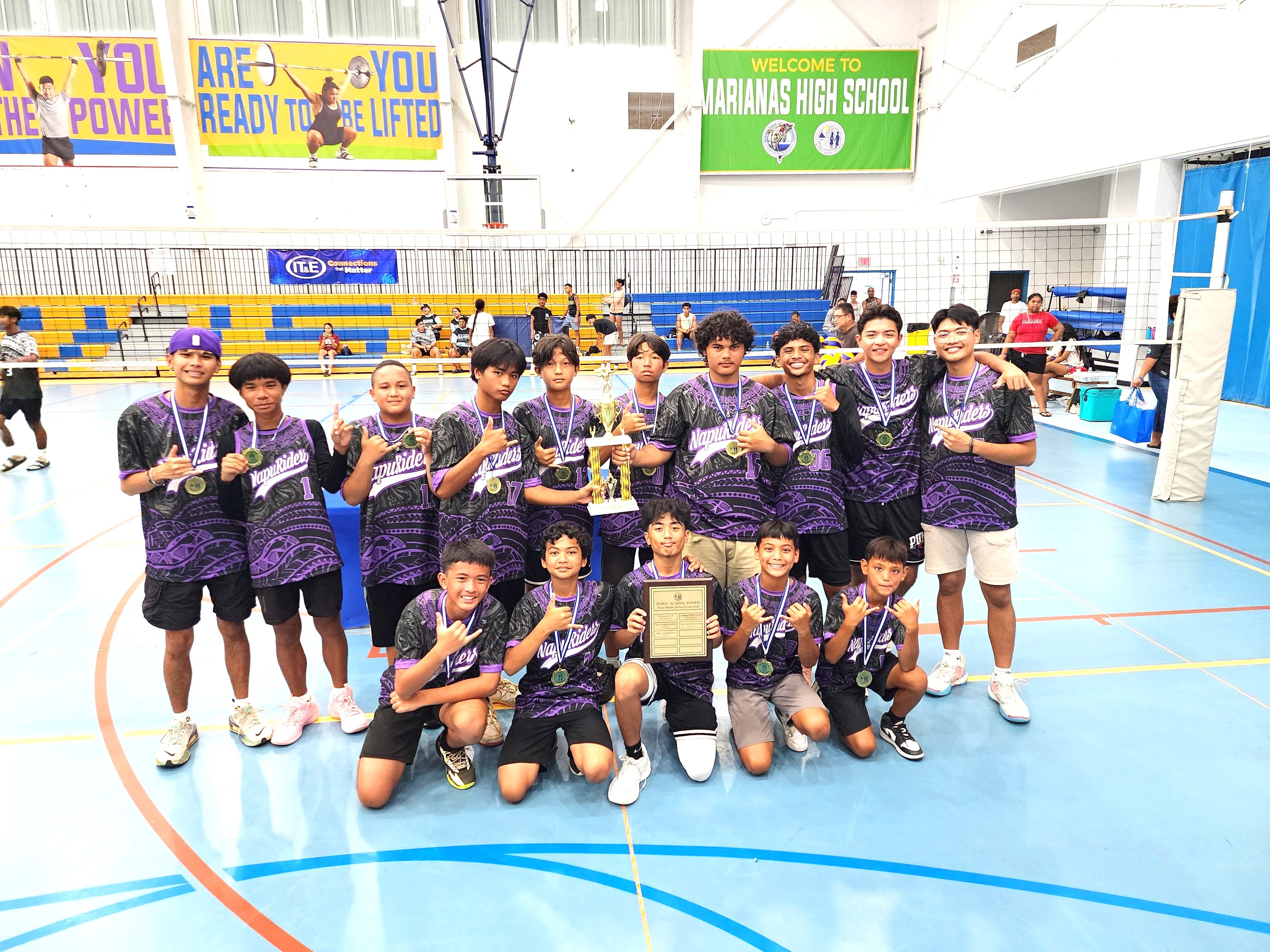 The Francisco M. Sablan Middle School boys volleyball team players pose with the championship trophy of the PSS-NMIVA Interscholastic Volleyball League SY24-25 at the MHS gym on Saturday.Photo by James F. Sablan Jr.
