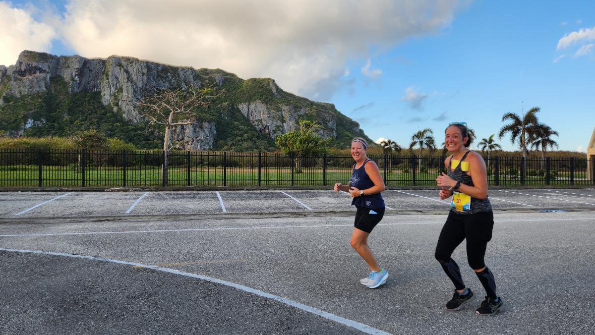 Ali Nelson, right, of the U.S. and a fellow marathoner smile during Skechers Saipan Marathon 2025 on March 8, 2025.