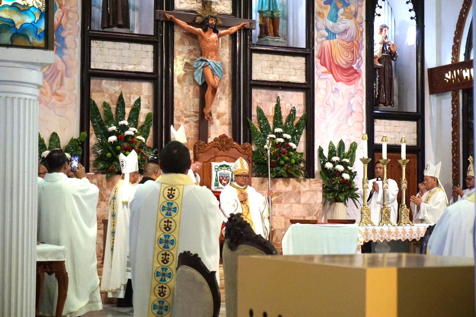 Romeo D. Convocar takes his seat on the cathedra for the first time as the bishop of the Diocese of Chalan Kanoa on Saturday at Mount Carmel Cathedral.