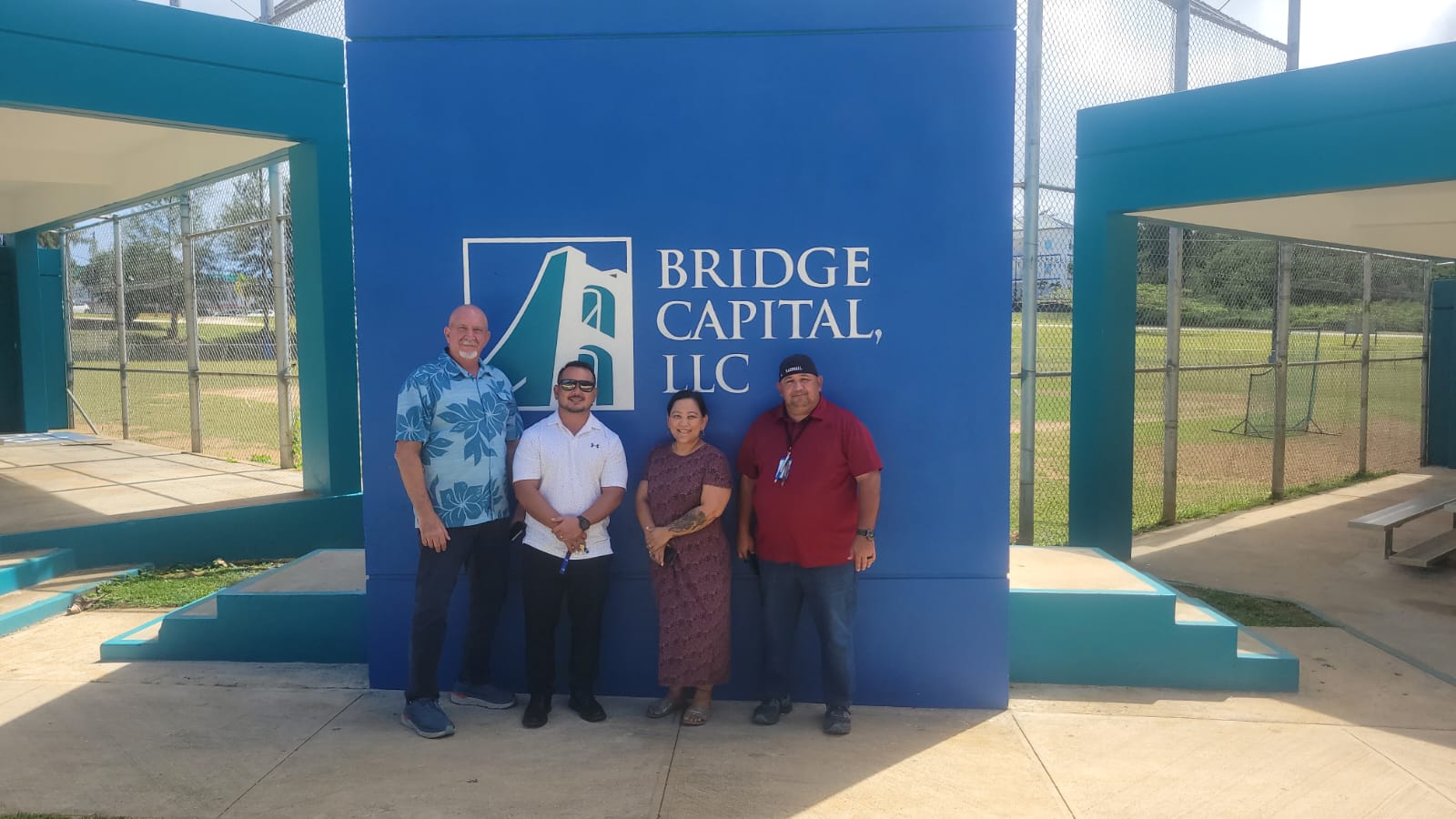 From left, Bart Jackson, VP for Bridge Capital LLC; Precinct 4 Rep. Joel Camacho; Julie Duenas, Bridge Capital office manager, and Parks and Rec Director Mike Cruz.