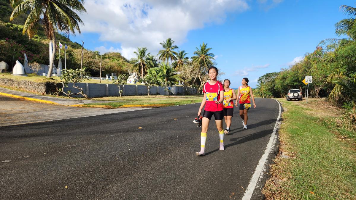 From left, teenagers Zhu Ruishi, Zhang Panpan, and Wu Saiwen in action during Skechers Saipan Marathon 2025 on March 8, 2025.