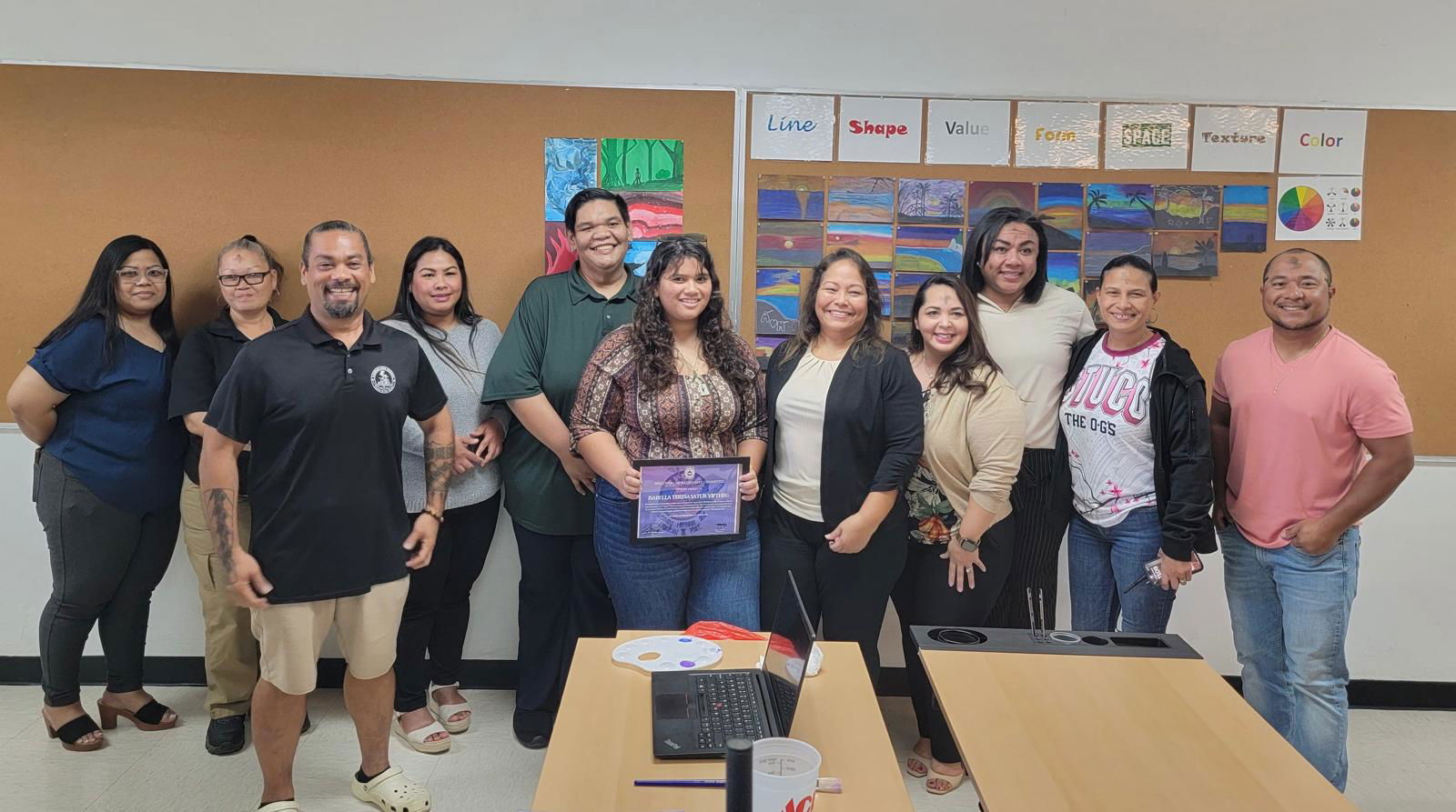 Isabella Teresa Satur Yiftheg, center, is the winner of the theme and logo competition for the 79th CNMI Liberation Day Celebration.Contributed photo