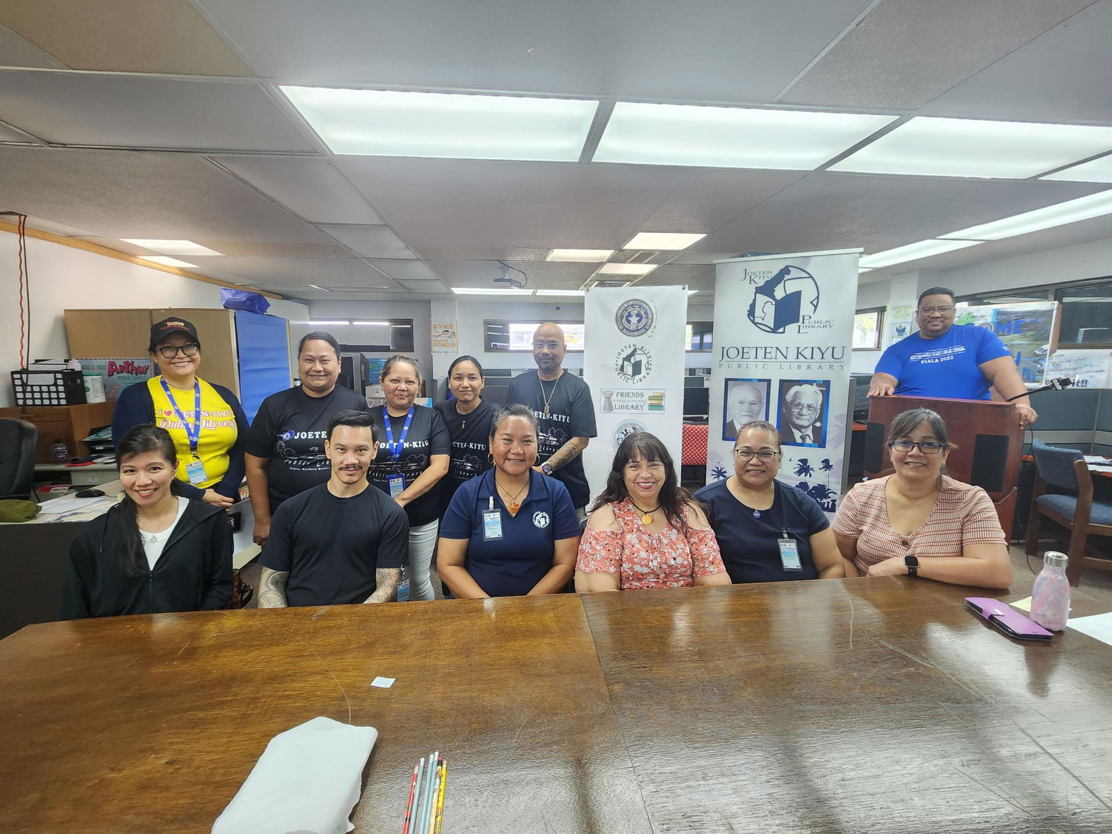 Guam and CNMI library officials and staff members pose for a group photo on Friday, after a week-long professional development training focused on library best practices. In photo: Joeten-Kiyu Public Library’s Beth Demapan, Celina Foreman, Leoralynn Terlaje, Carrie Camacho, Omar Manacop, Joey Songsong, and Director Erlinda Naputi with Guam Public Library System’s Angie Taitague, Florence Taitague, Bryan Pacheco, Jenelle Cruz, and Jane Dorion.