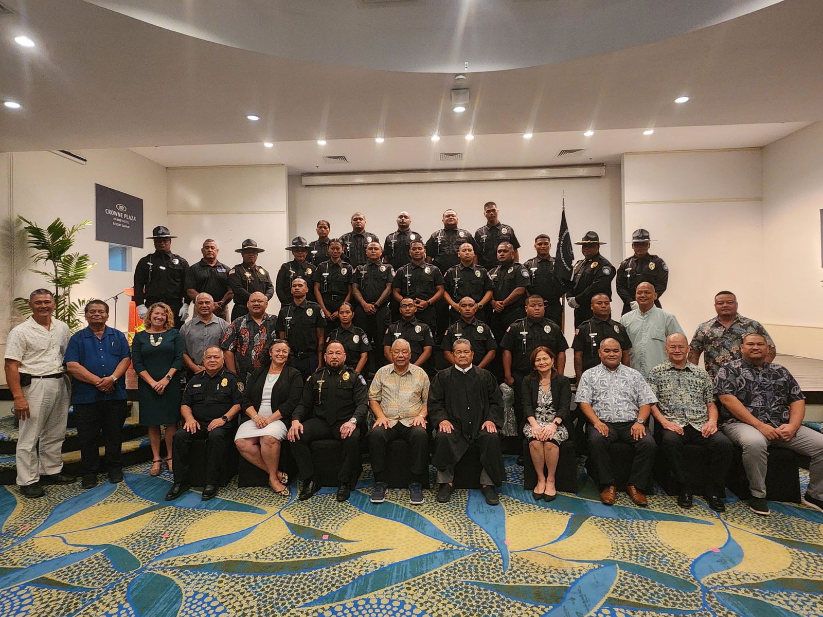 The 17 new Corrections officers pose for a photo with trainers and CNMI government officials at Crowne Plaza Resort Saipan on Friday, Feb. 28, 2025.
