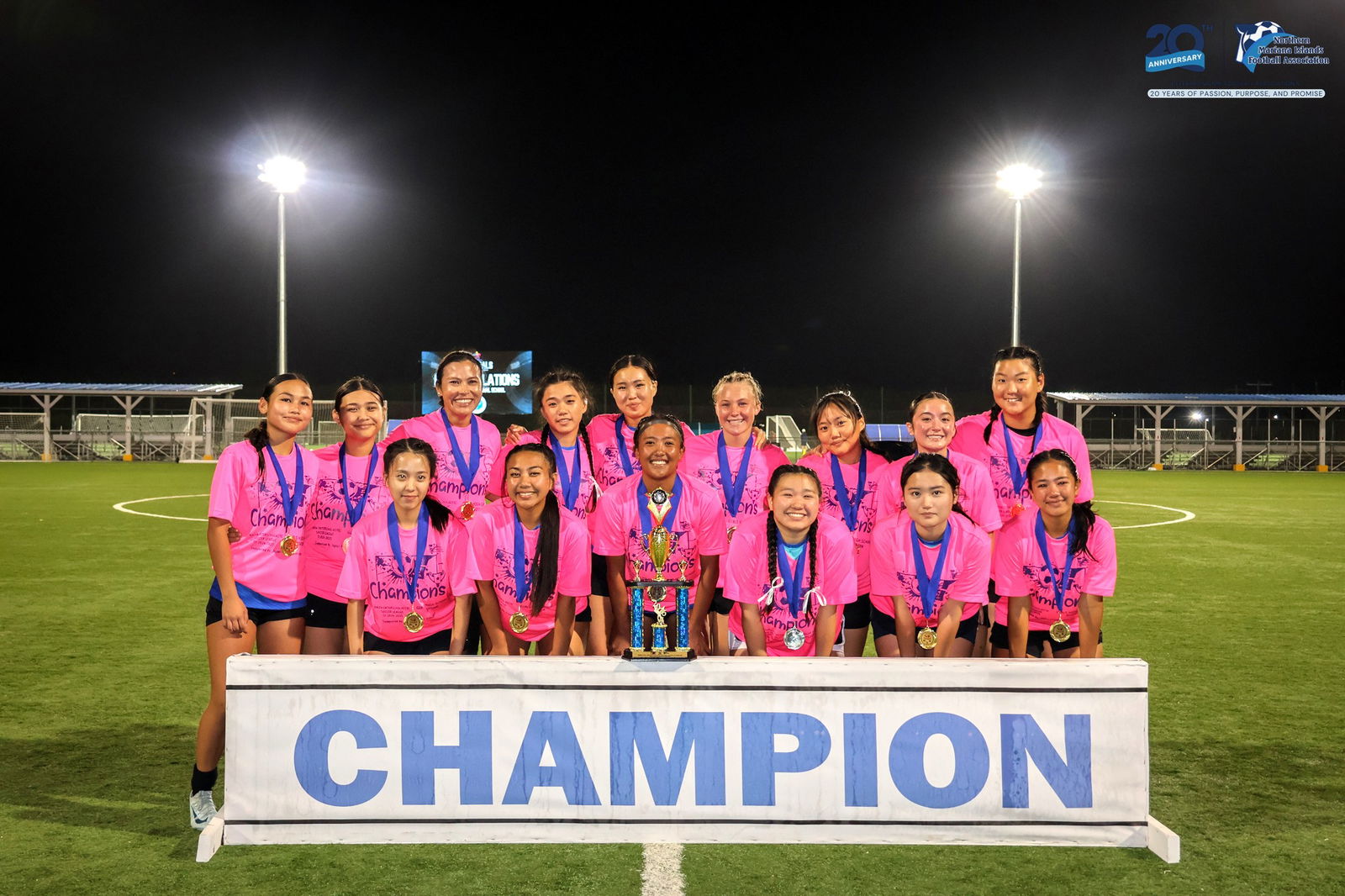 Saipan International School players pose with the girls high school division championship trophy of the PSS-NMIFA Interscholastic Soccer League SY24-25 at the NMI Soccer Training Center in Koblerville.
