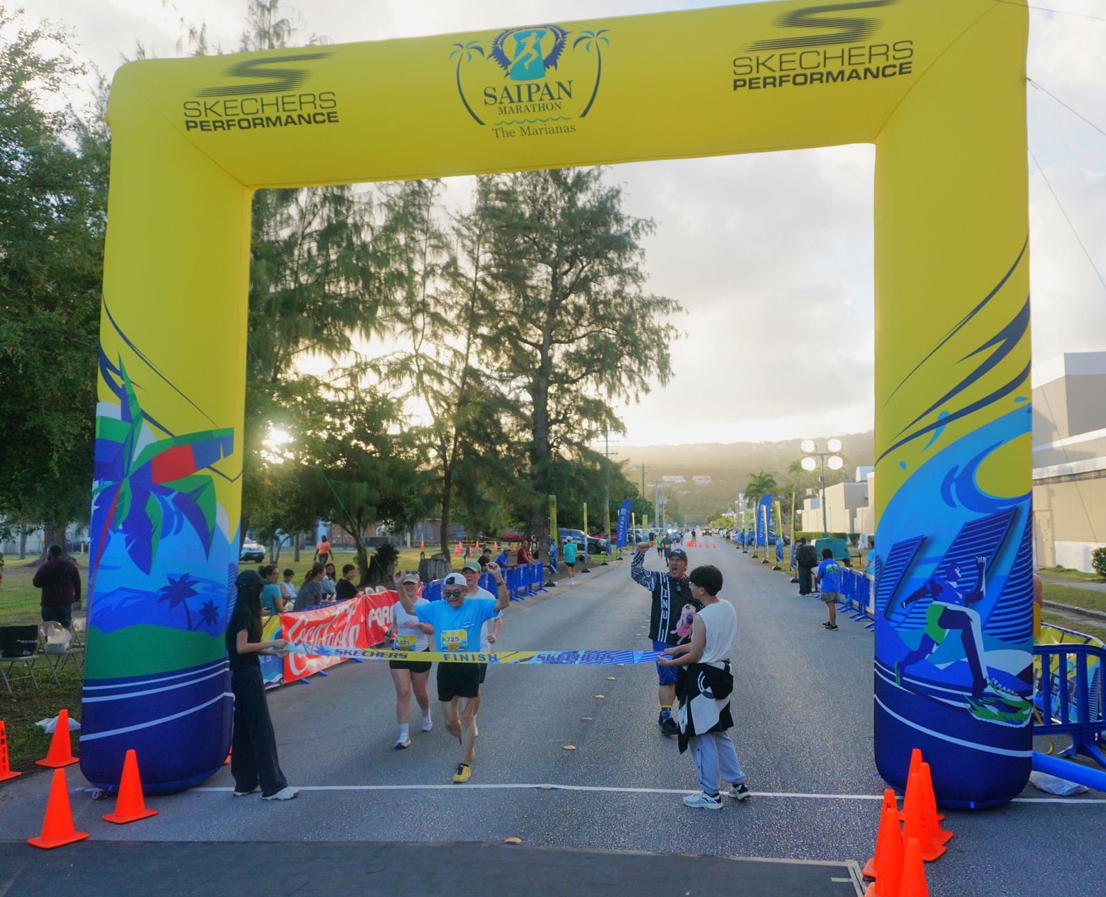 A runner celebrates as he crosses the finish line of the Skechers Saipan Marathon 2025 at Micro Beach on Saturday morning.