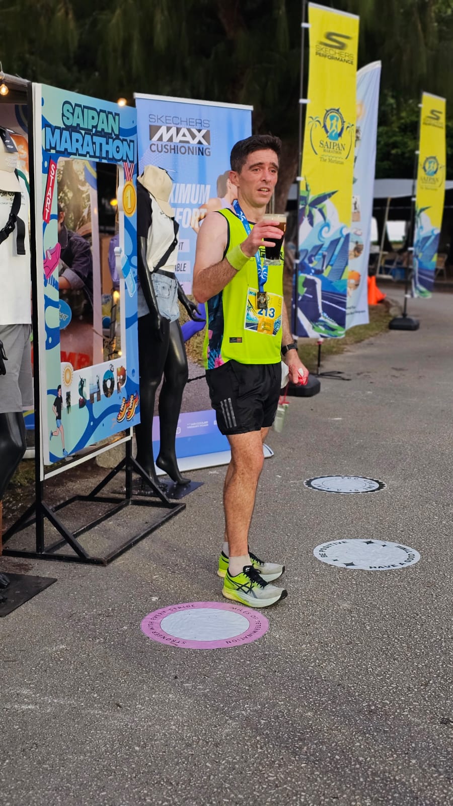 Jody O'Sullivan celebrates his 1st place finish in the half marathon of Skechers Saipan Marathon 2025.