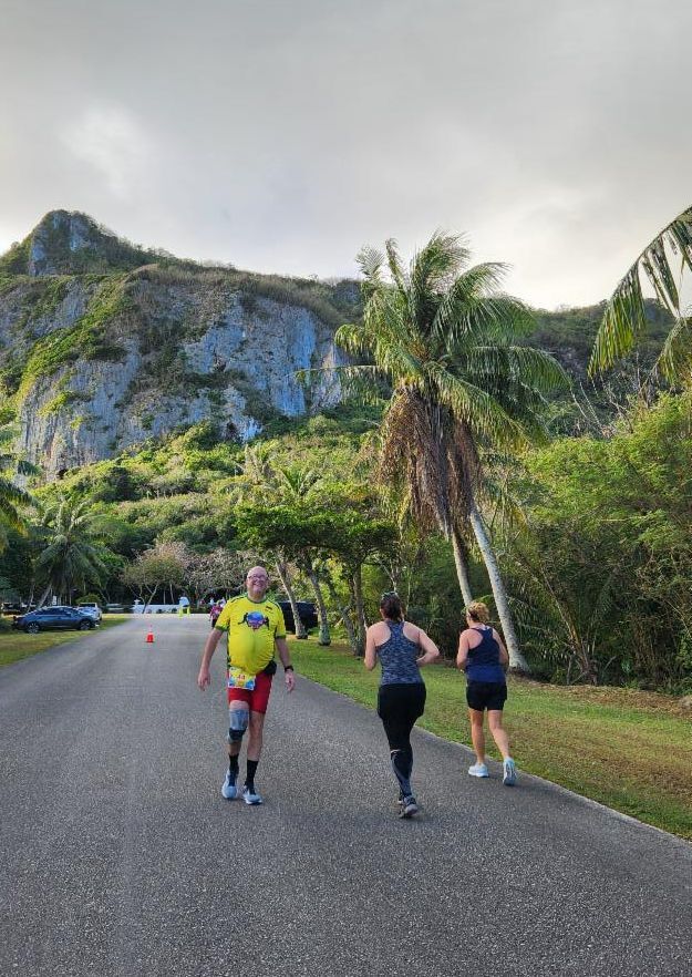Thomas Godlewsky of Germany, left, and other runners pass through scenic Marpi during Skechers Saipan Marathon 2025 on March 8, 2025.