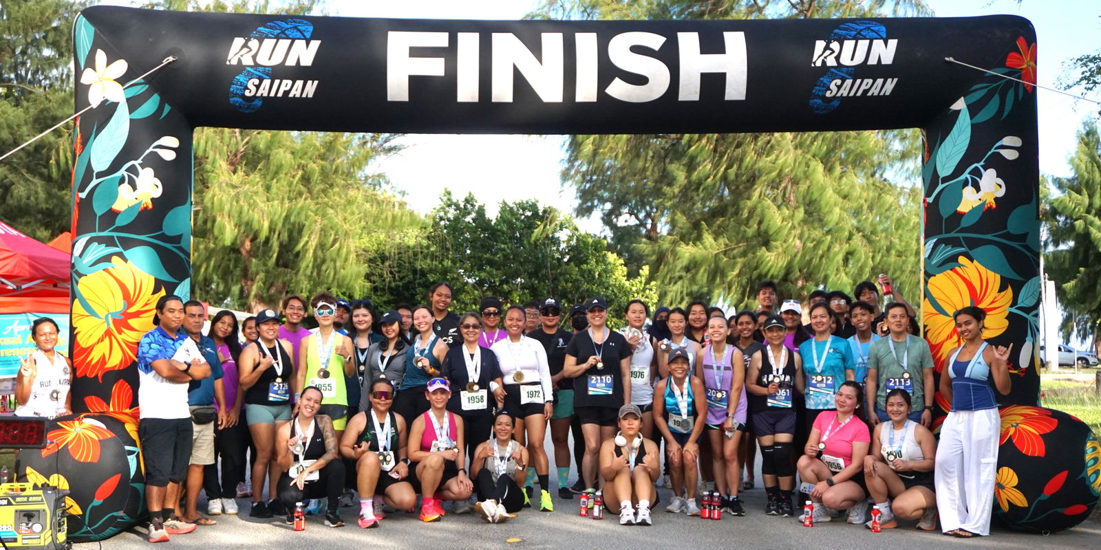 The participating runners pose for a photo at the conclusion of the Northern Marianas Athletics’ 5th Annual NMI 10km Women’s Run at Micro Beach on Saturday morning.Photo by James F. Sablan Jr.