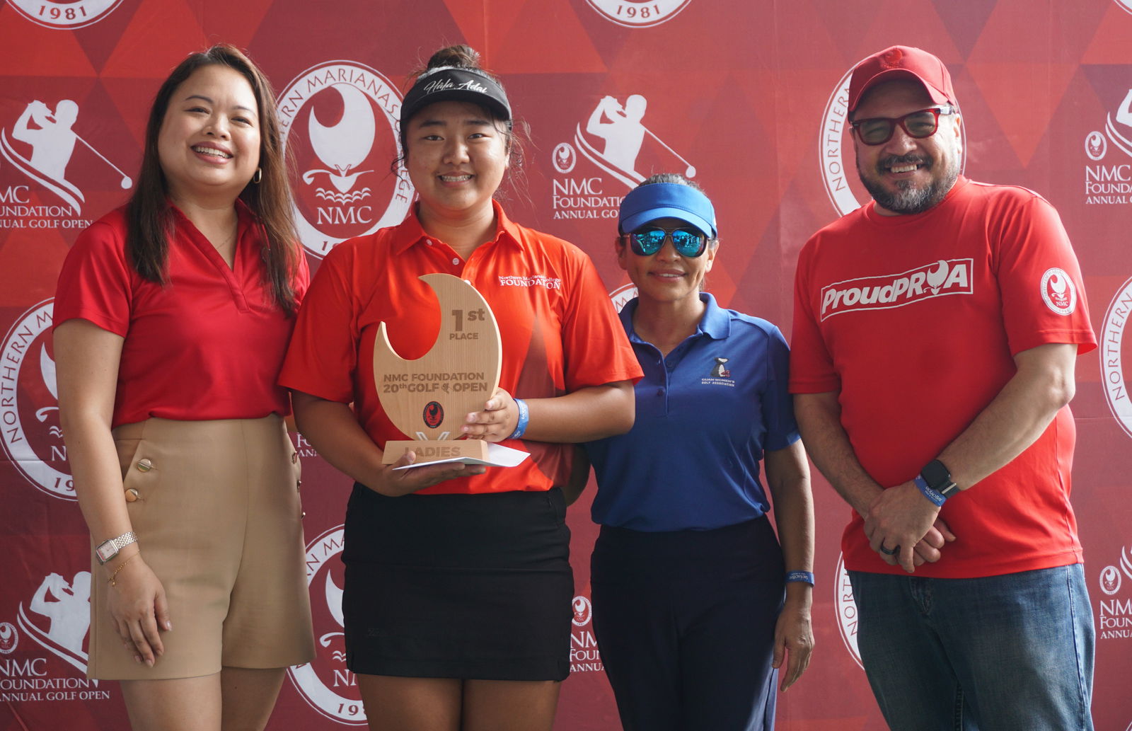 Zhimin Jin, 2nd left, the Ladies Flight winner, with Northern Marianas College Regent Michelle Lin Sablan, left, Guam Hotel and Restaurant Association President Mary Rhodes, 2nd right, and NMC President Galvin Deleon Guerrero, EdD during the awards banquet of the 20th Annual NMC Foundation Golf Open at LaoLao Bay Golf & Resort on Sunday,Photo by James F. Sablan Jr.