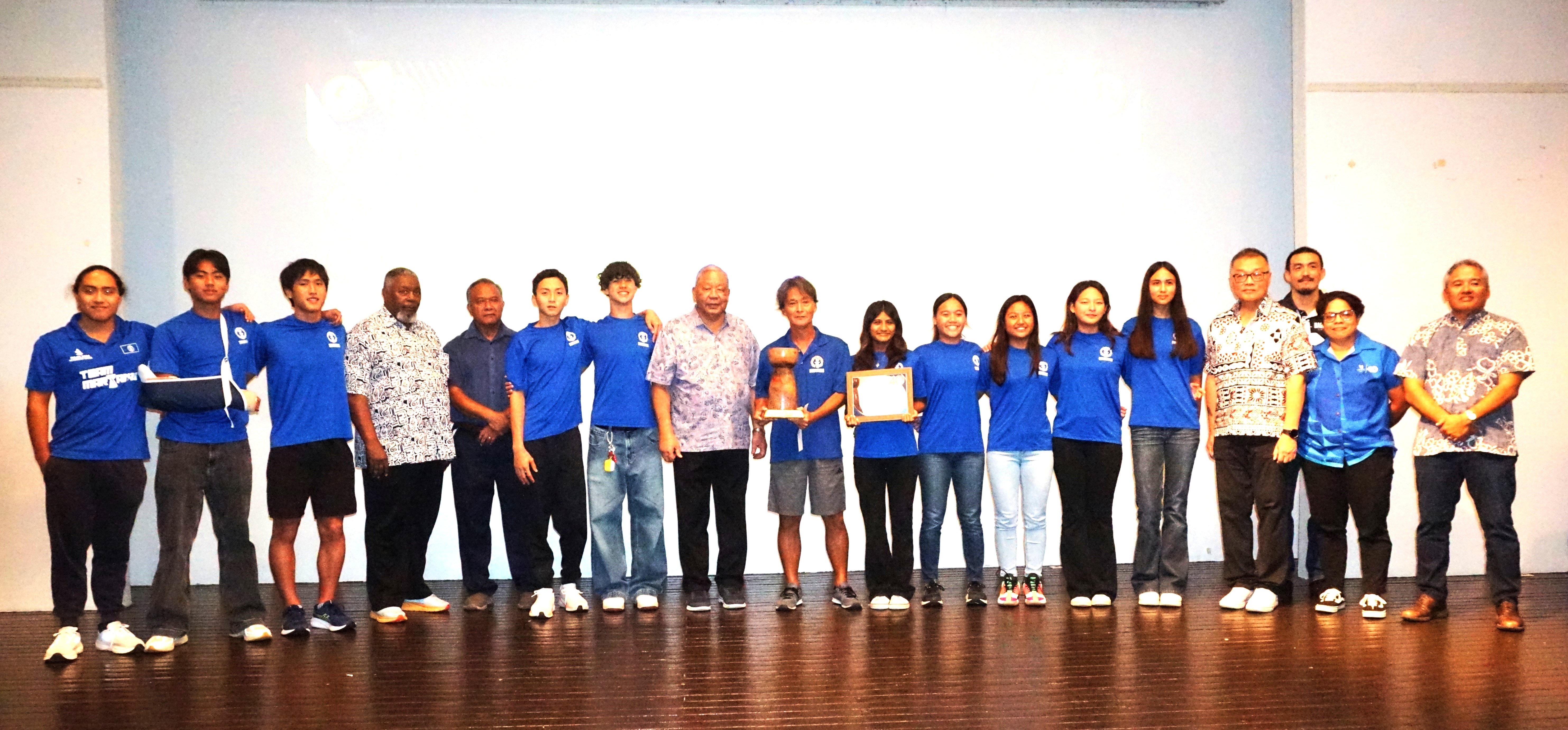 The NMI National Swimming Team members pose with the Team of the Year Award alongside the NMSA board members during the Northern Marianas Sports Association annual awards banquet and 40th anniversary celebration in the Taga Hall of Crowne Plaza Resort Saipan on Thursday.Photo by James F. Sablan Jr.