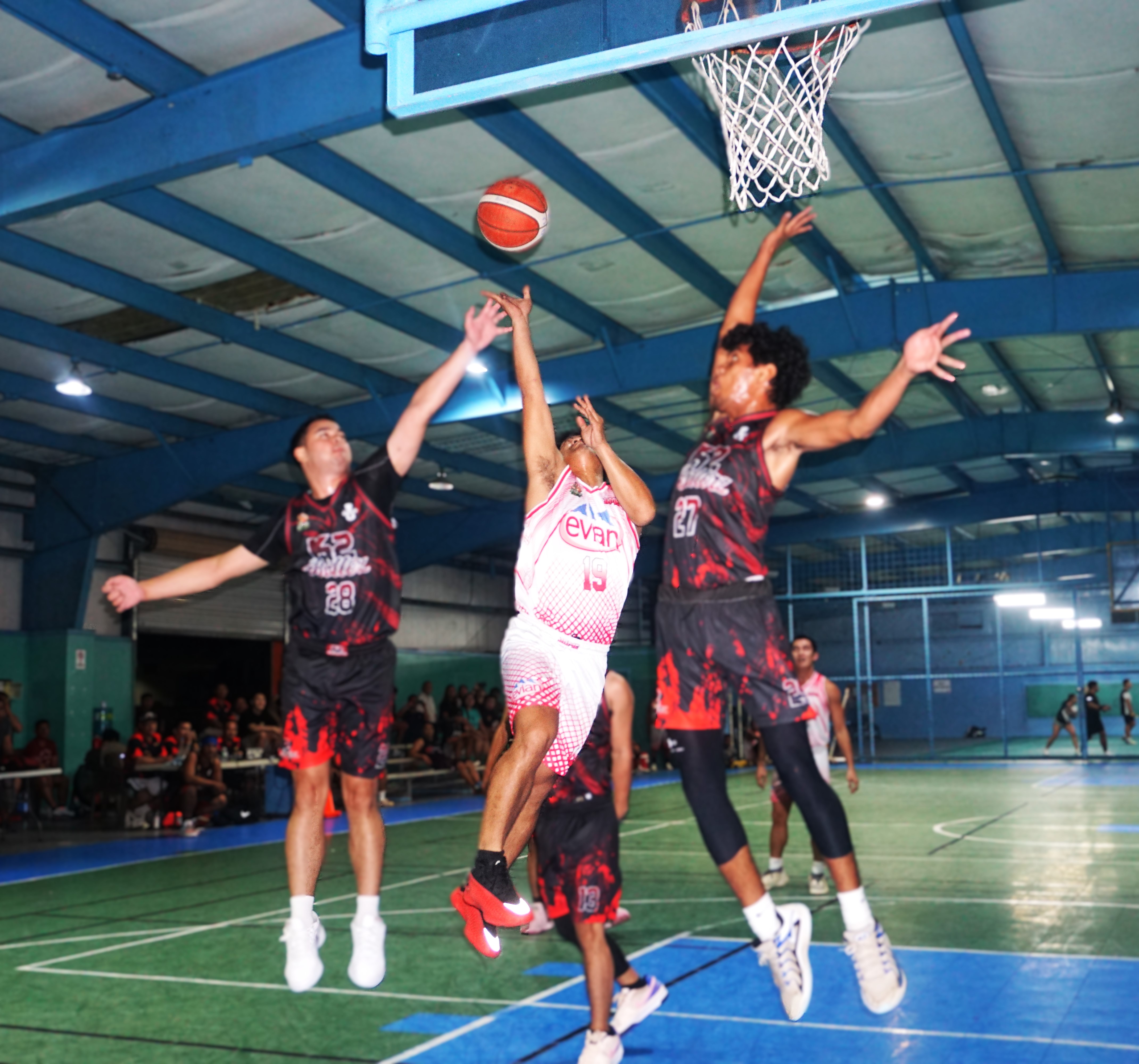 JC Marketing’s Rodel Pastrana gets fouled as he goes up for the finish during a game against K2 Ballerz in the Alpha Kappa Rho 1st Semi-Open Invitational Basketball League at the TSL Sports Complex on Tuesday.