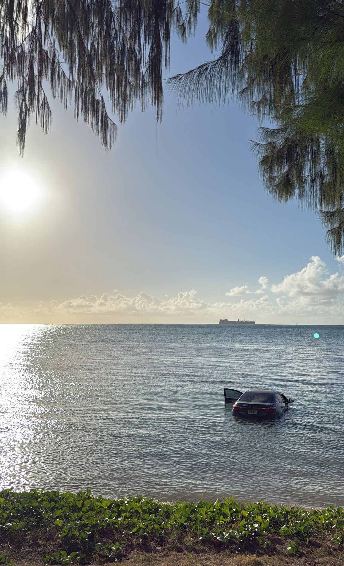 This sedan veered off Beach Road and into the Saipan Lagoon on Monday afternoon.DPS photo