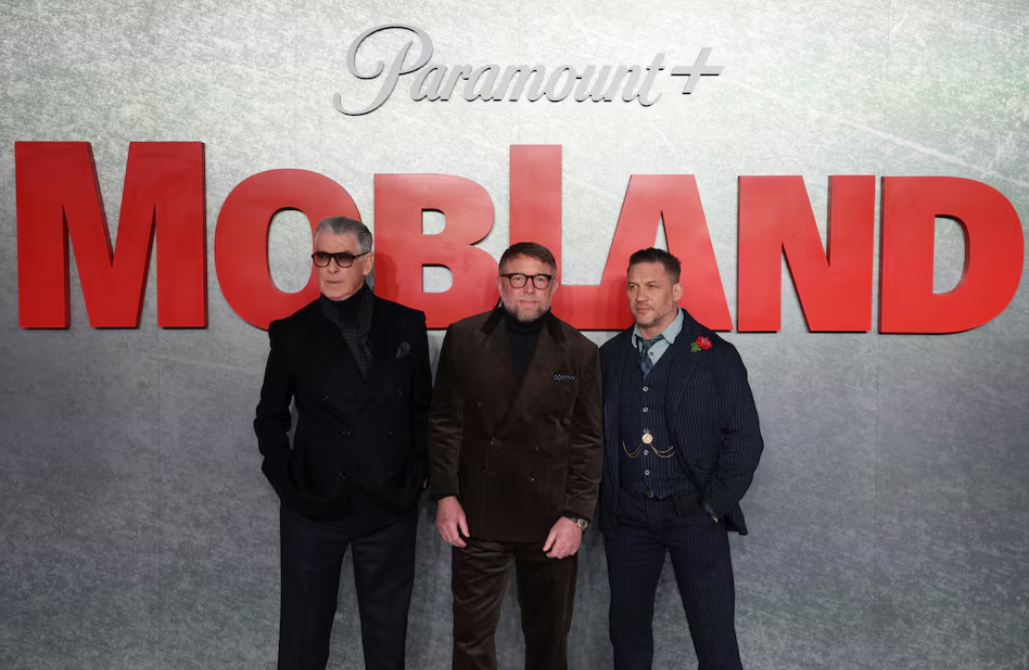 Director Guy Ritchie, cast members Tom Hardy and Pierce Brosnan attend the premiere of the TV series "MobLand" in London, Britain, March 27, 2025.REUTERS