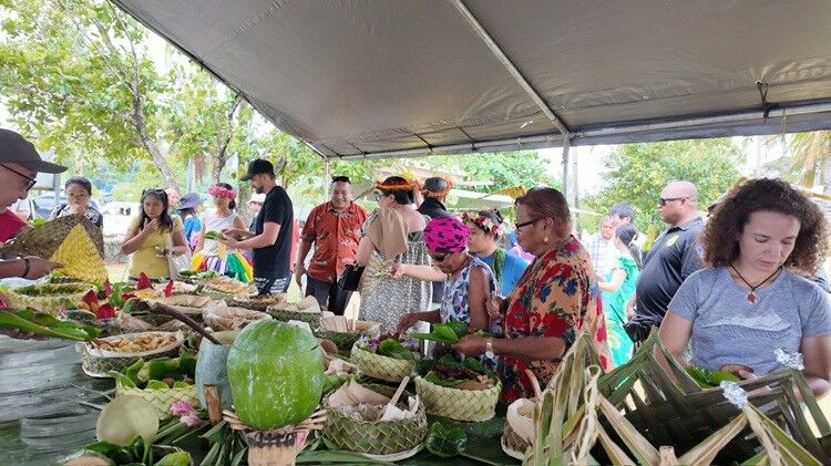 Sampling local cuisine during Yap Day 2025 celebrations.