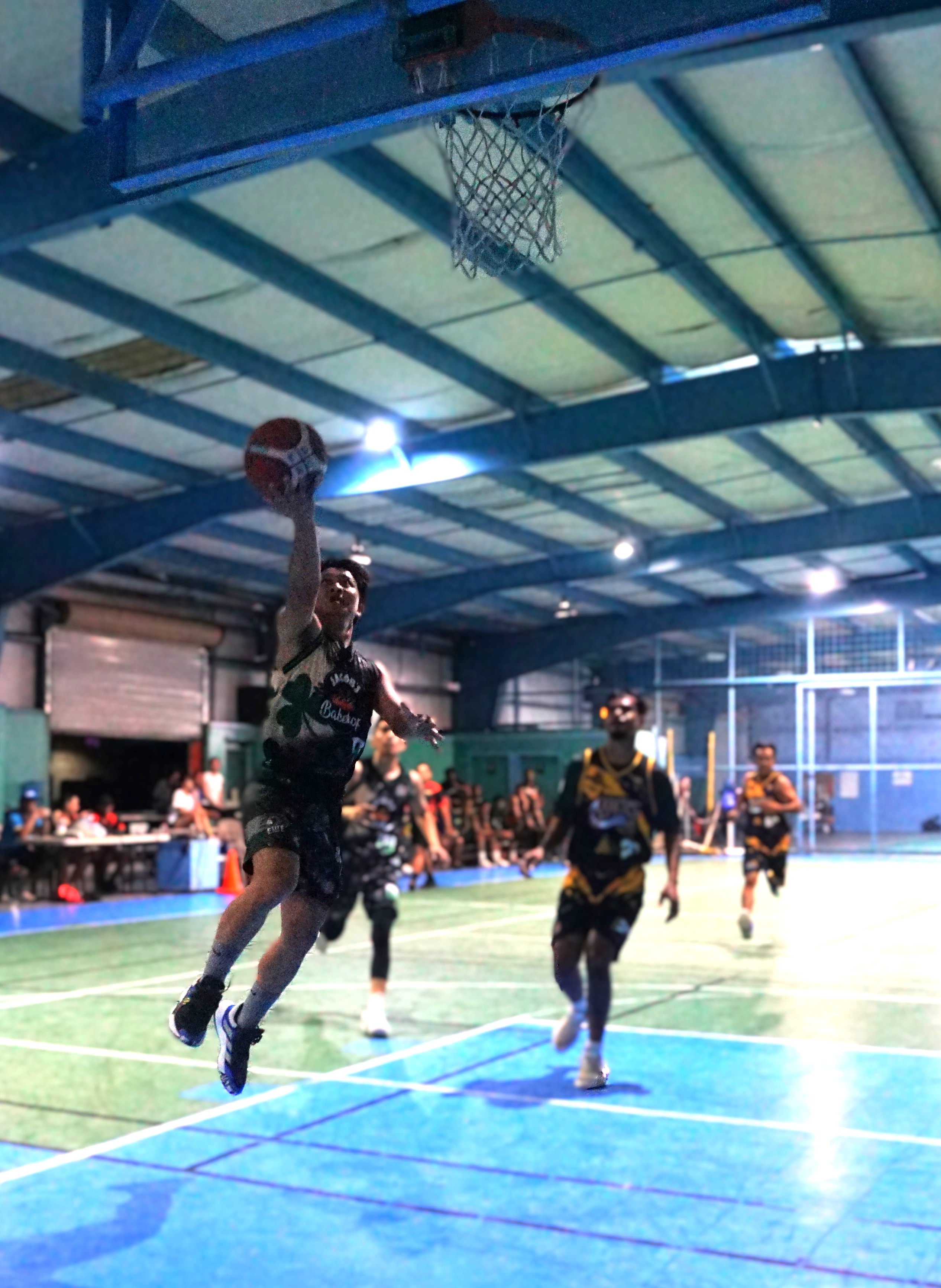 Arjhay Singca of Jacob’s Bakery extends for the finish during a game against the 69ers in the Alpha Kappa Rho 1st Semi-Open Invitational Basketball League 2025 at the TSL Sports Complex on Sunday.