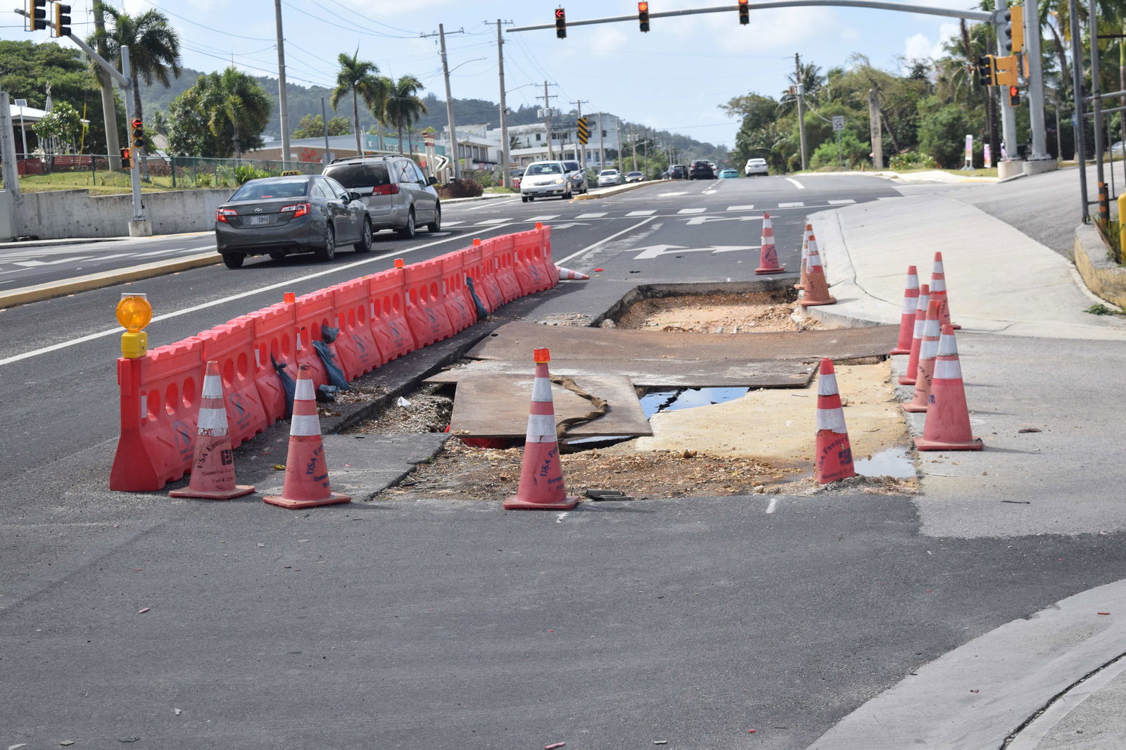 An outer lane of Middle Road’s southbound side in Garapan is coned off for motorists’ safety.