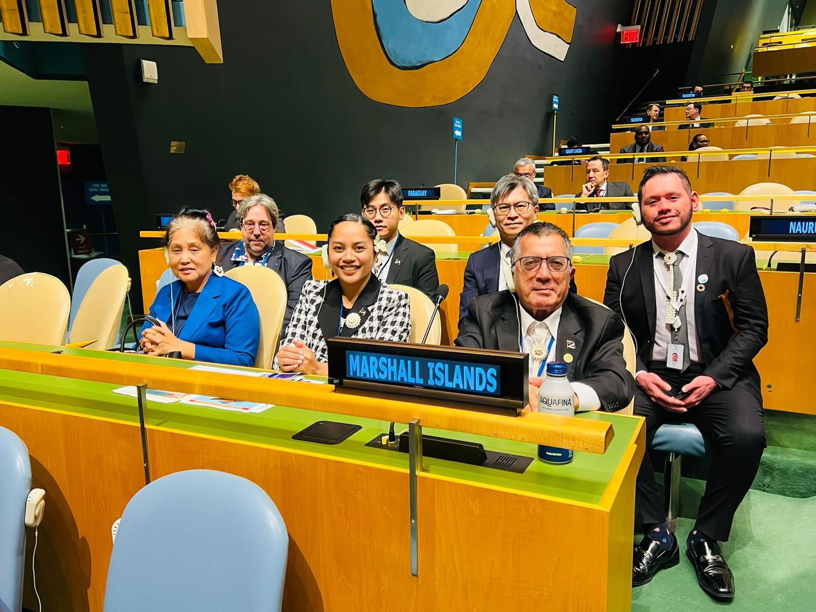 Marshall Islands Ambassador to the United Nations John Silk, seated at right with members of the Marshall Islands delegation, in the General Assembly hall in New York last October following the country's election to the U.N. Human Rights Council.