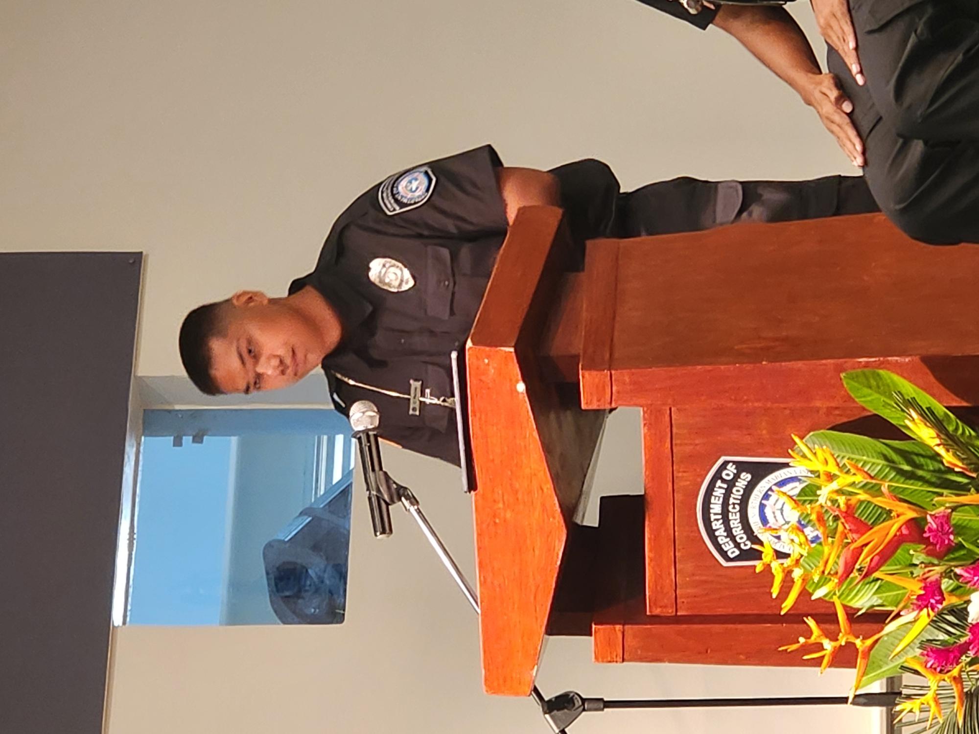 10th Corrections Academy valedictorian and Top Gun CO1 Cleo Pacho delivers his remarks.