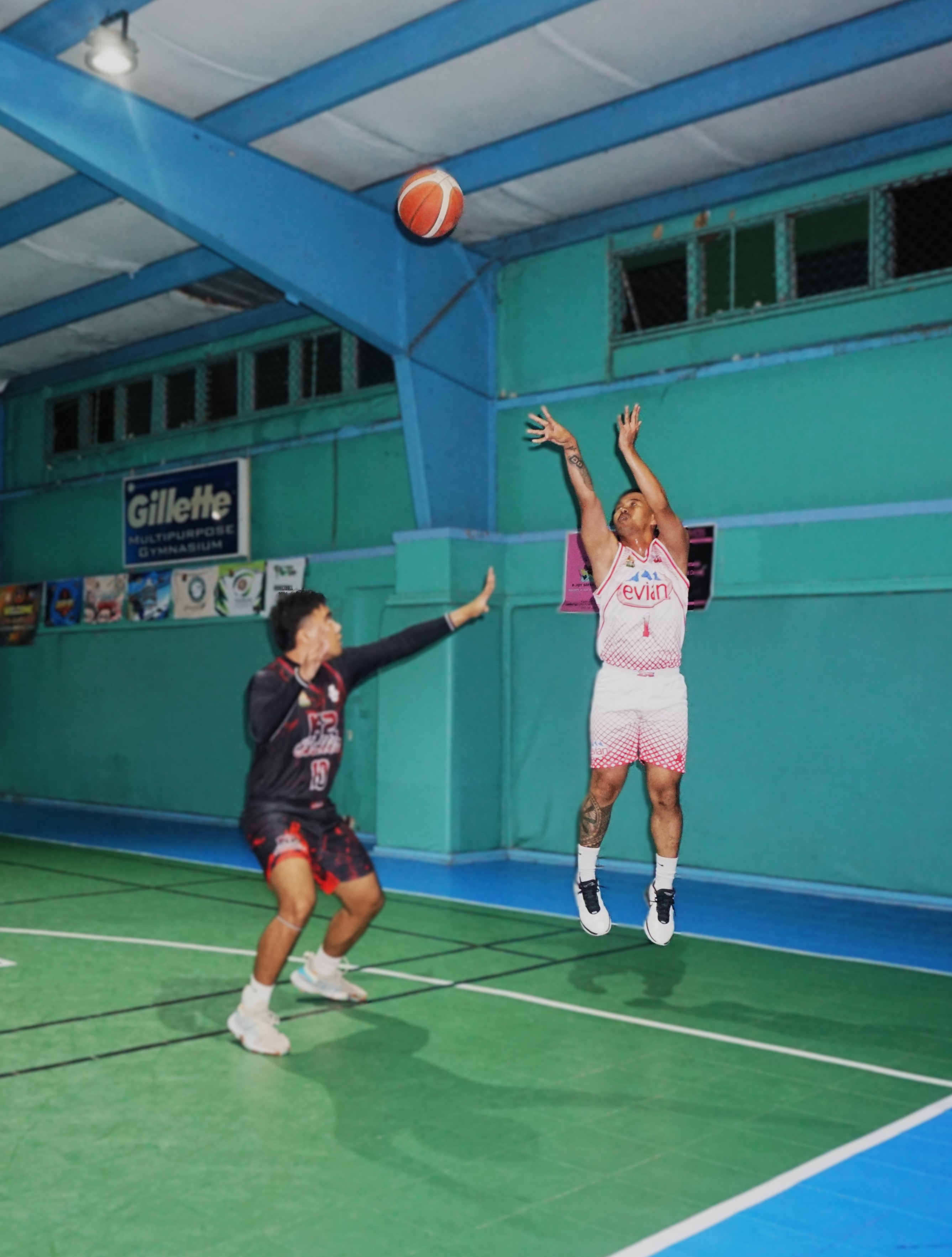 JC Marketing's Keith Santos pulls up for the three-point shot during a game against K2 Ballerz in the Alpha Kappa Rho 1st Semi-Open Invitational Basketball League at the TSL Sports Complex on Tuesday.