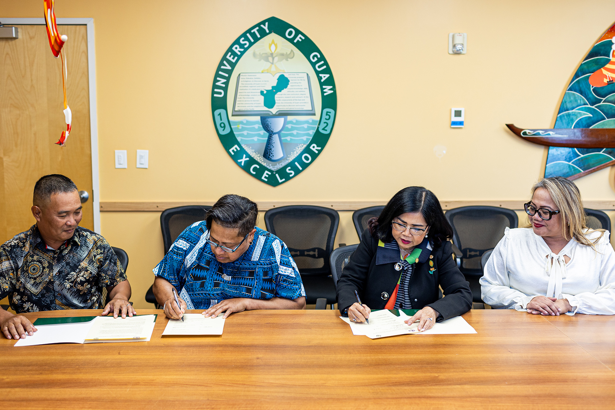 From left, Steven Young-Uhk, vice president of extension for the College of Micronesia-FSM; COM-FSM President and CEO Theresa Koroivulaono; University of Guam President Anita Borja Enriquez; and Sharleen Santos-Bamba, senior vice president and provost for UOG.