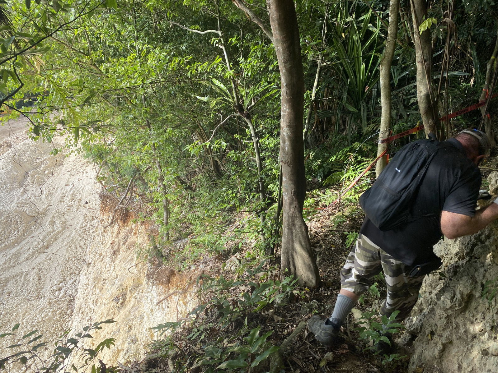After showing Variety the caves that were affected by quarrying activities, Bill Harwood walks down to the trail.
