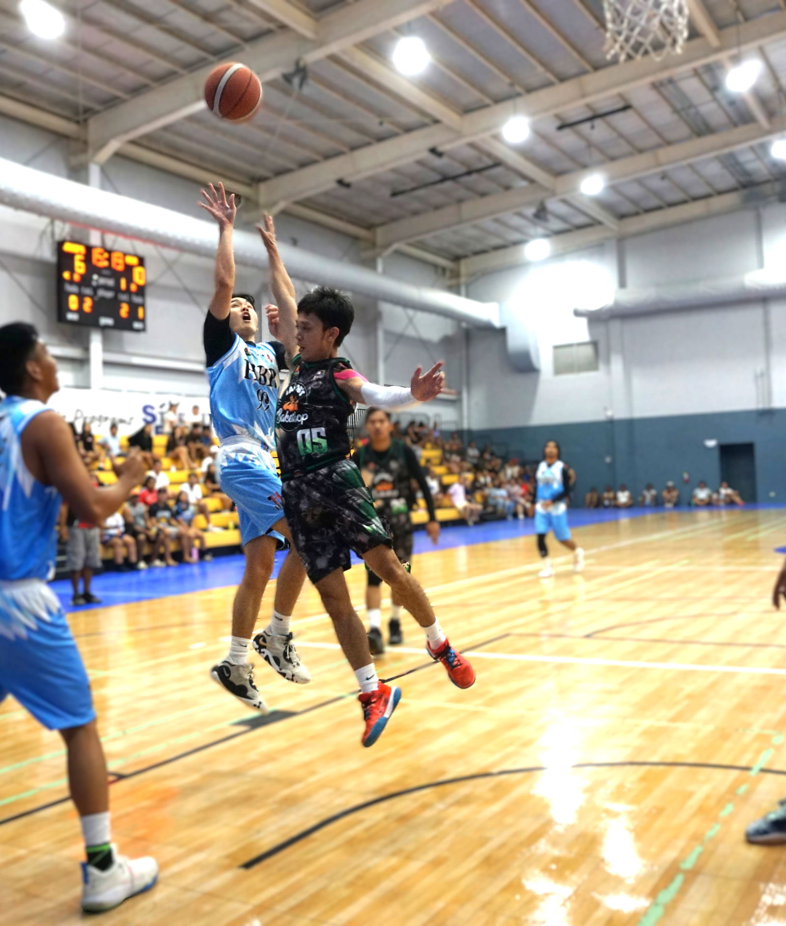 HBR Construction’s Tony Kim takes the contested floater during the championship game against Jacob’s Bakery in the Alpha Kappa Rho 1st Semi-Open Invitational Basketball League 2025 at the Gilbert C. Ada Gymnasium on Sunday night.Photo by James F. Sablan Jr.