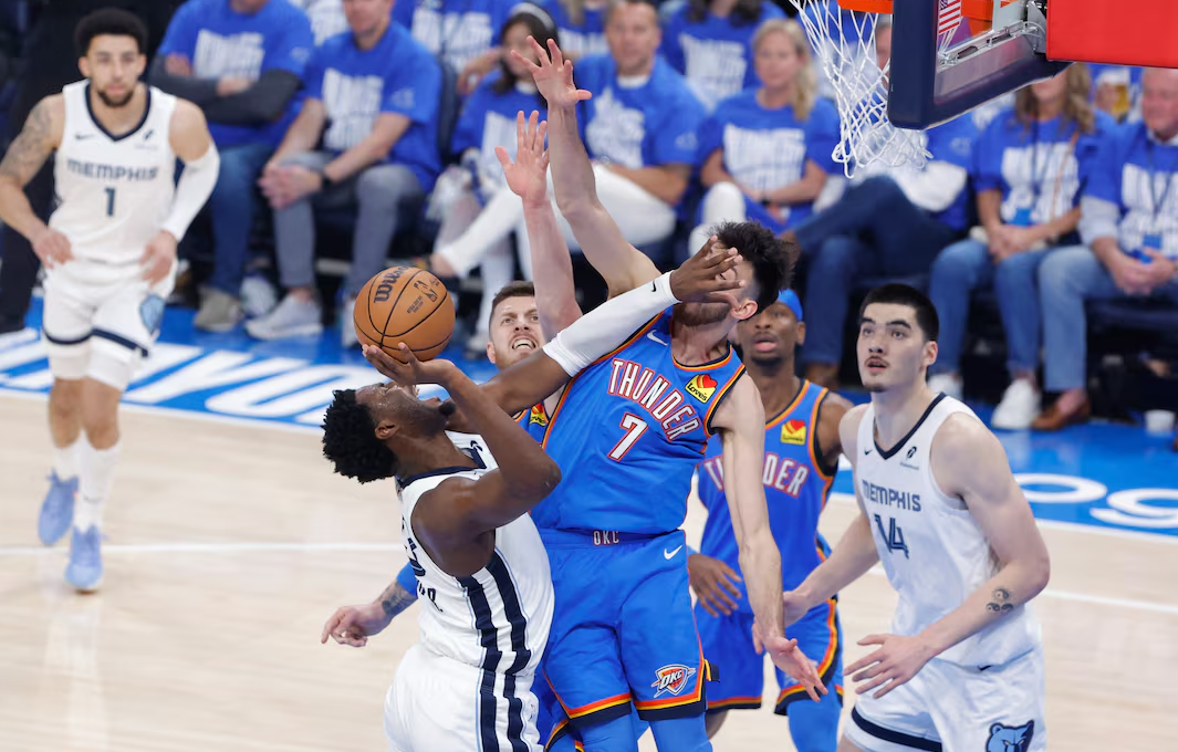 Memphis Grizzlies forward Jaren Jackson Jr. (13) shoots as Oklahoma City Thunder center Isaiah Hartenstein (55) and forward Chet Holmgren (7) defend the shot in the first quarter during game two of first round for the 2024 NBA Playoffs at Paycom Center in Oklahoma City, April 22, 2025.Photo by Alonzo Adams/Imagn Images