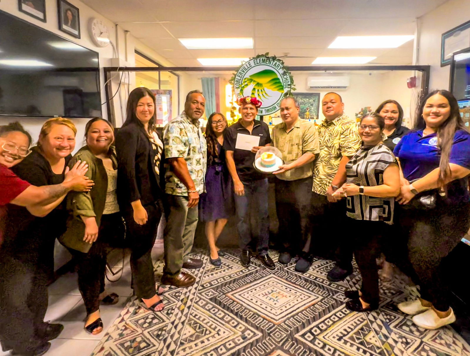 Koblerville Elementary School Vice Principal Jonas M. Barcinas with Acting BOE Chairman Anthony Dela Cruz Barcinas, BOE member Andrew L. Orsini, Acting Commissioner of Education Jacqueline Che, Associate Commissioner of Administrative Service Eric Magofna, Director of Finance Arlene Lizama, Human Resource Office Director Lucretia Deleon Guerrero, Special Education Program State Director Donna M. Flores, Career and Technical Education Director Dr. Jessica Taylor, BOE staff members Jocelyn Saures and Mary Jo Camacho along with Principal Naomi Nishimura.
