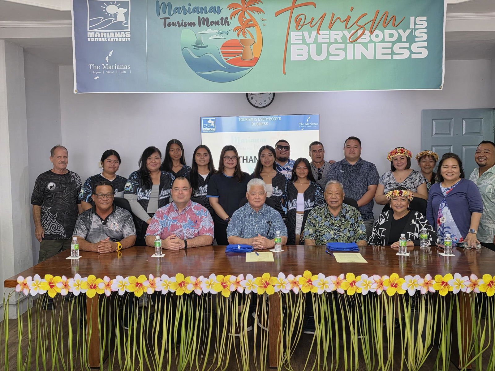 CNMI officials led by Gov. Arnold I. Palacios and Lt. Gov. David M. Apatang pose for a photo with Marianas Visitors Authority officials and staff during the Marianas Tourism Month proclamation signing ceremony on Tuesday.Photo by Bryan Manabat