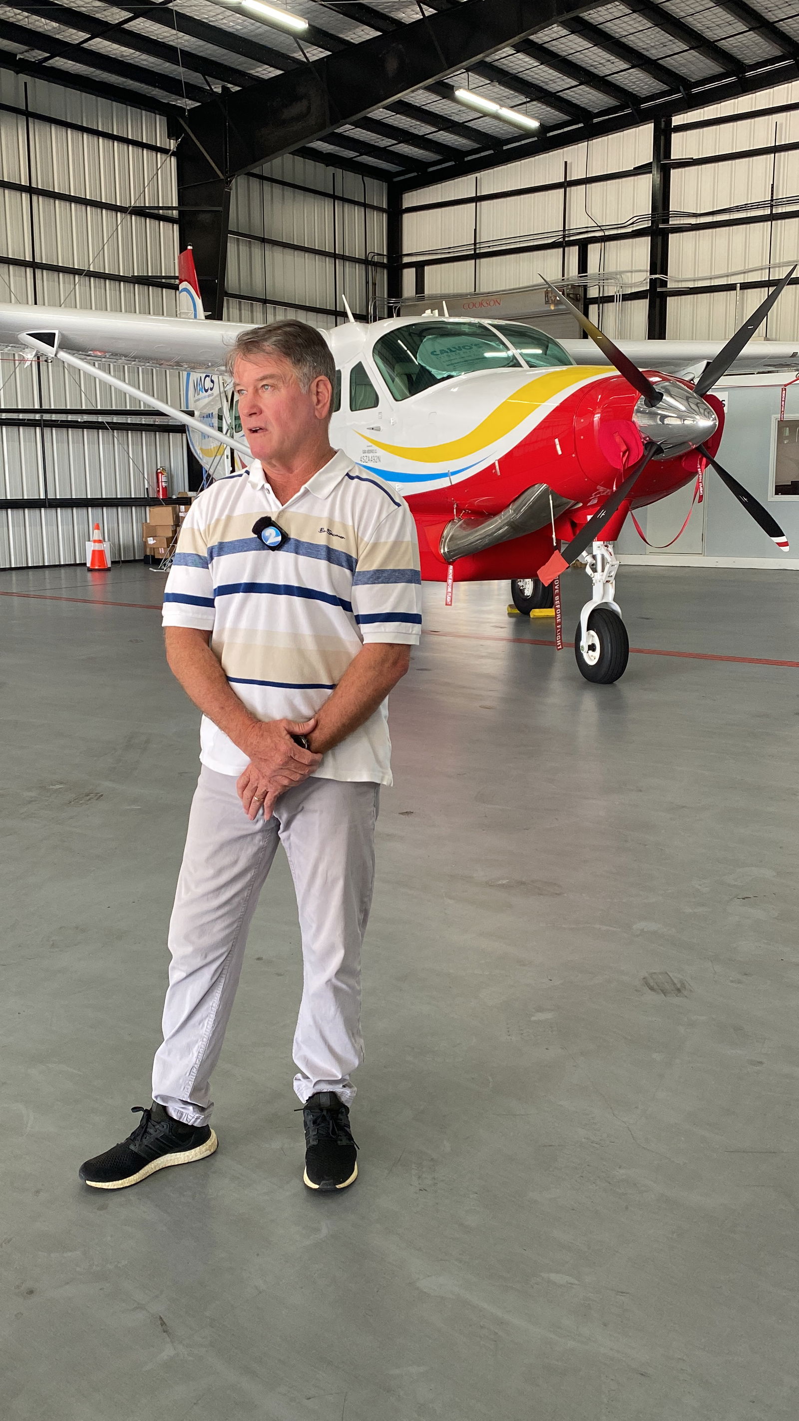 John Stewart speaks to the media in front of the newest airplane in MACS’ fleet — a Cessna Caravan built in January.