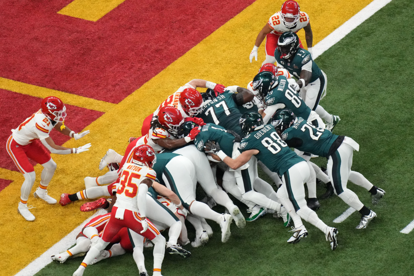 Philadelphia Eagles quarterback Jalen Hurts (1) rushes the ball for a touchdown against the Kansas City Chiefs during the first quarter in Super Bowl LIX at Caesars Superdome in New Orleans, Feb. 9, 2025.Photo by Kirby Lee-Imagn Images