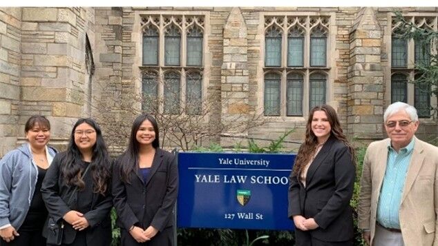 The team was accompanied by, from left, chaperone Darlene Aldan, Judiciary representative Isabele Castle, and coach Stephen Woodruff.