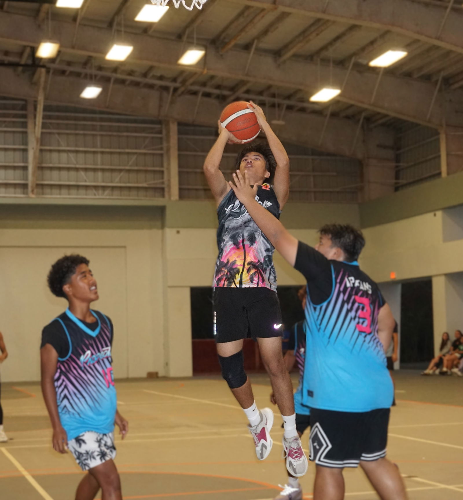 G Rollers’ James Enriquez finishes strong at the rim during the championship game of the NMIBF 2025 U15 Basketball League at the Koblerville gym on Friday.