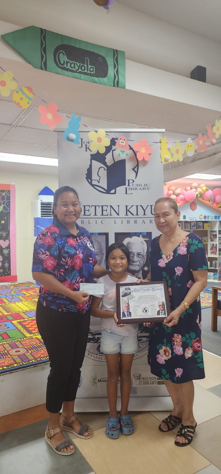 CNMI first lady Wella Palacios, right, and Library Director Erlinda C. Naputi, left, with one of the participants of the 2025 Summer Reading Program.