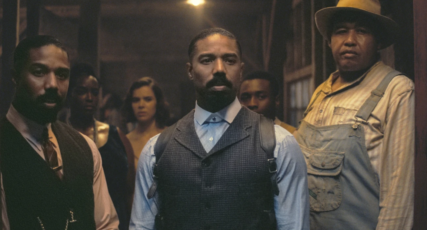 Michael B. Jordan, foreground from left, Michael B. Jordan and Omar Benson Miller in a scene from “Sinners.”Warnes Bros. Pictures via AP