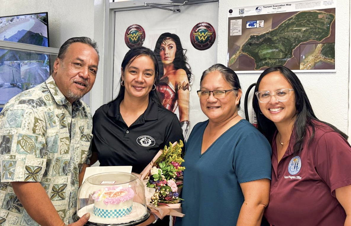 Dr. Rita Hocog Inos Jr. Sr. High School Vice Principal Desiriee Pendergrass, second left, with Acting BOE Chairman Anthony L. Barcinas, left, Principal Annette Calvo, and PSS Federal Programs Office staff Nadine Pua.