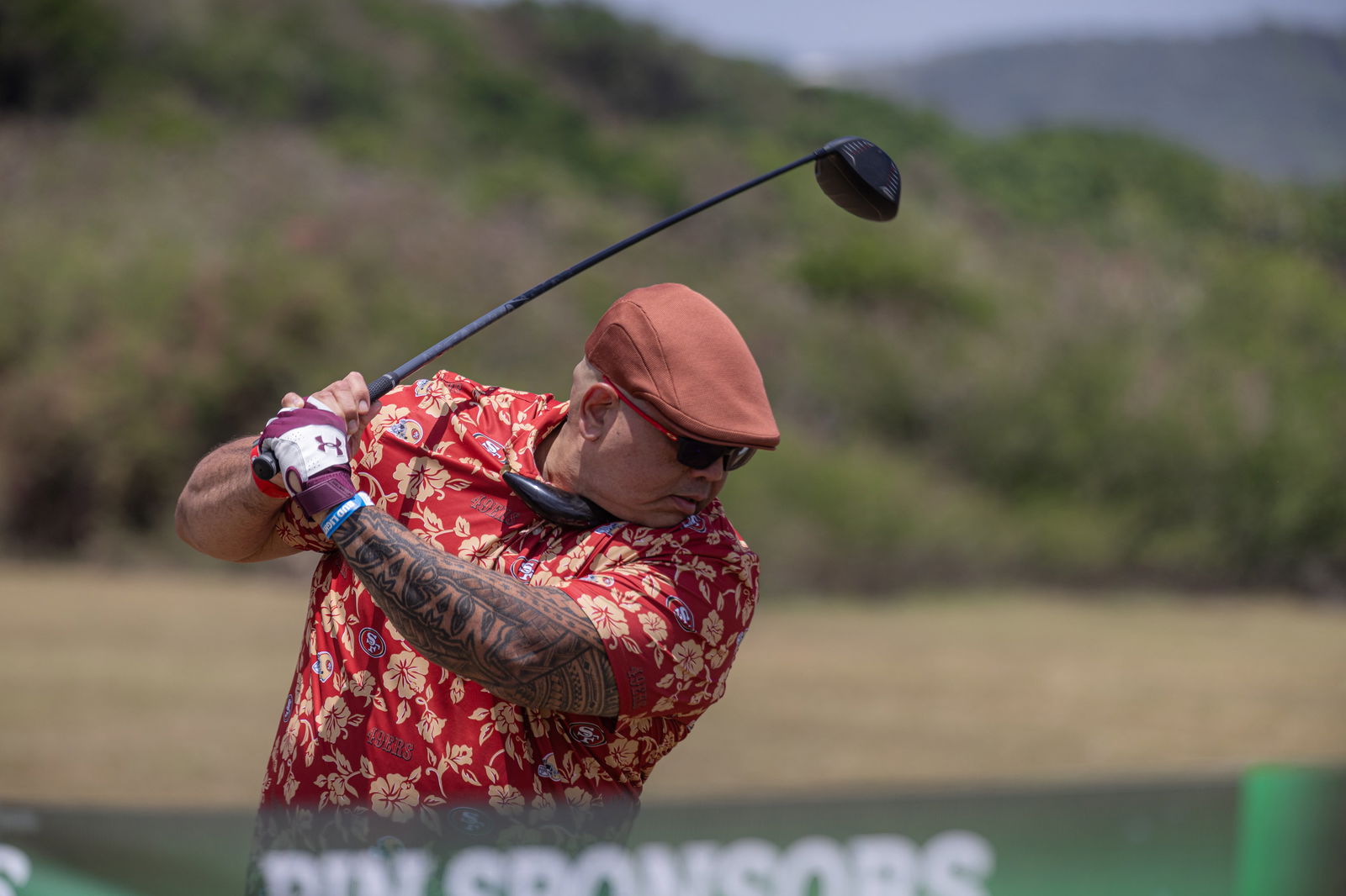 Roland San Nicolas, Associate Professor of Library Science at the University of Guam, readies his swing at the University of Guam Golf Challenge held at Country Club of the Pacific on March 30, 2025.
