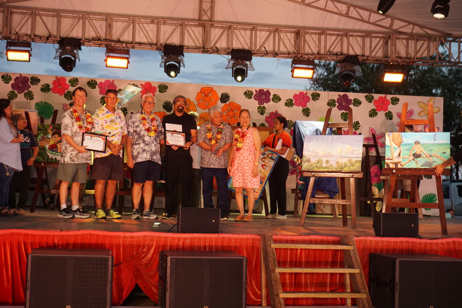 John Moreno receives his award for "Follow the Guardian." Not in photo is the other winner, Denglian Stinson.