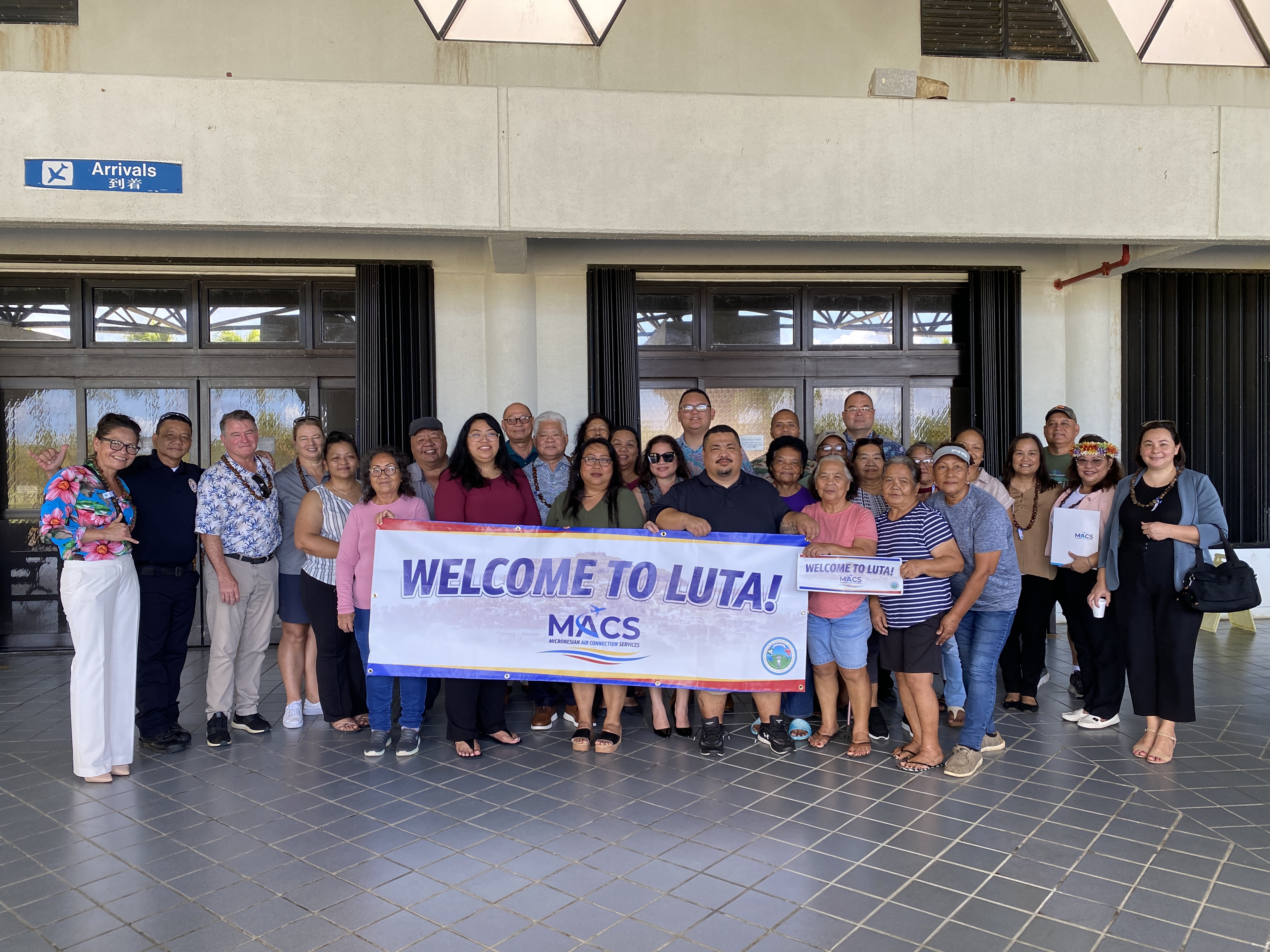 Rota Mayor Aubry Hocog and other island residents welcome the passengers of MACS’s inaugural flight to the Friendly Island.