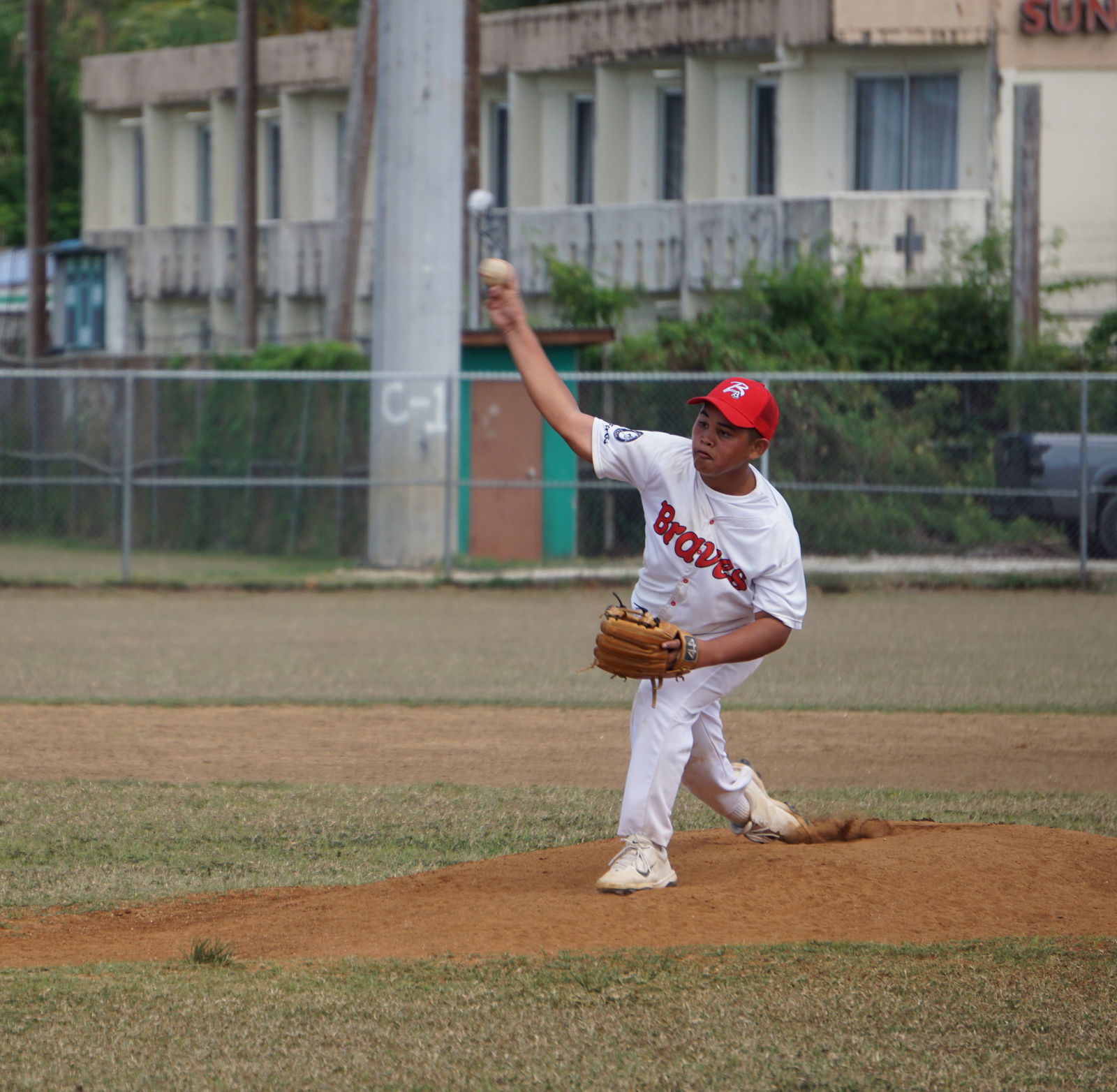 Braves Jr.'s Donray Barcinas pitches against Ol'Aces Jr. during a Junior Division game of the 2025 Saipan Little League Baseball at the Francisco "Tan Ko" Palacios Baseball Field on Saturday.Photo by James F. Sablan Jr.