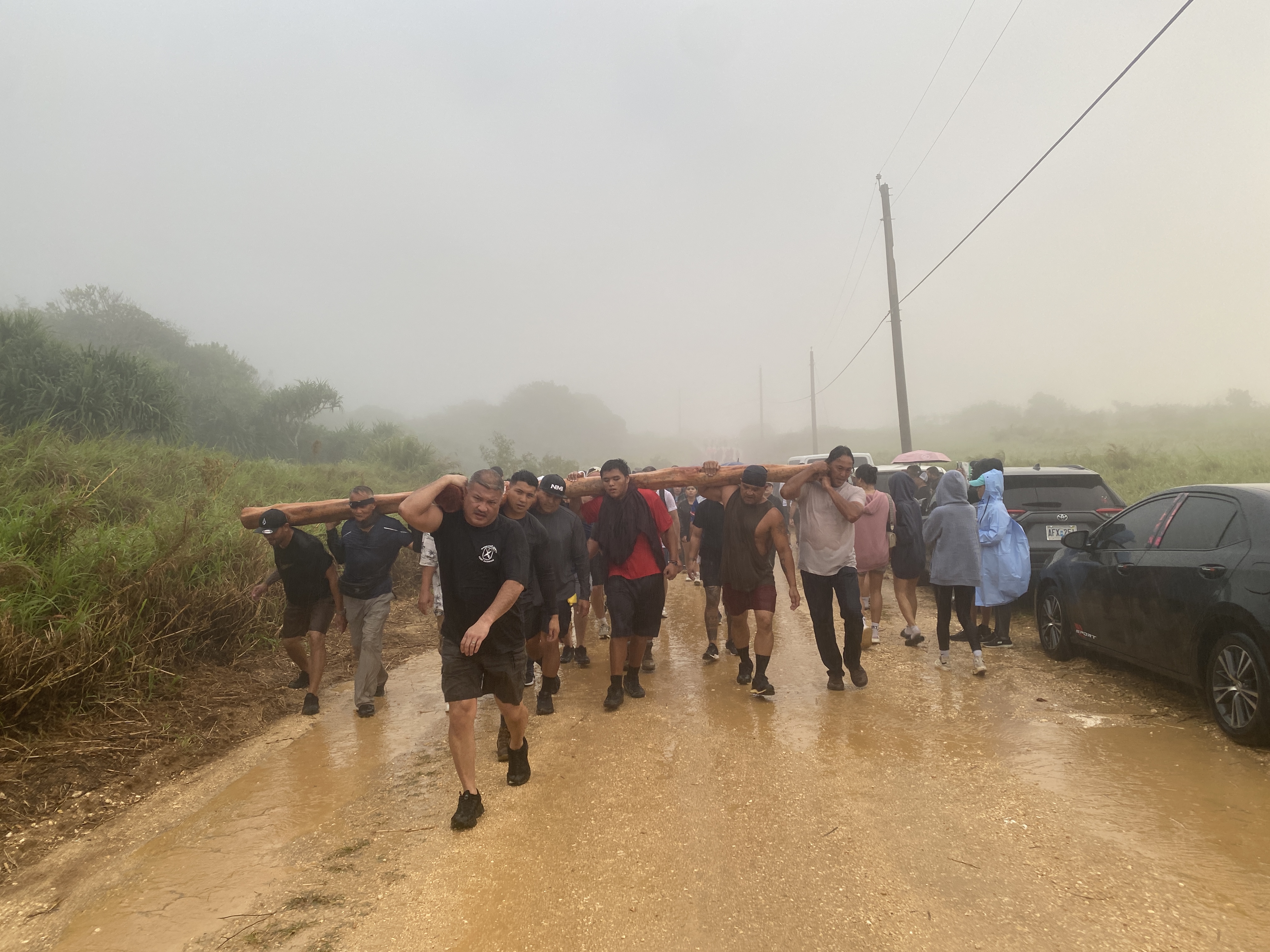 Devotees carried a wooden cross as they made their way up Mt. Tapochao, the island’s highest summit, on Good Friday as part of a local Holy Week tradition.