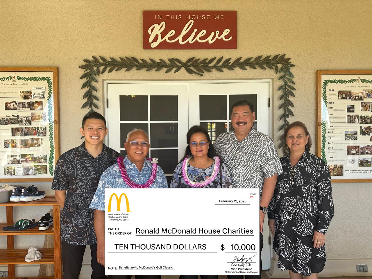 Jose and Marcia Ayuyu present a check for $10,000 to the Ronald McDonald House Charities on Feb. 12, 2025.