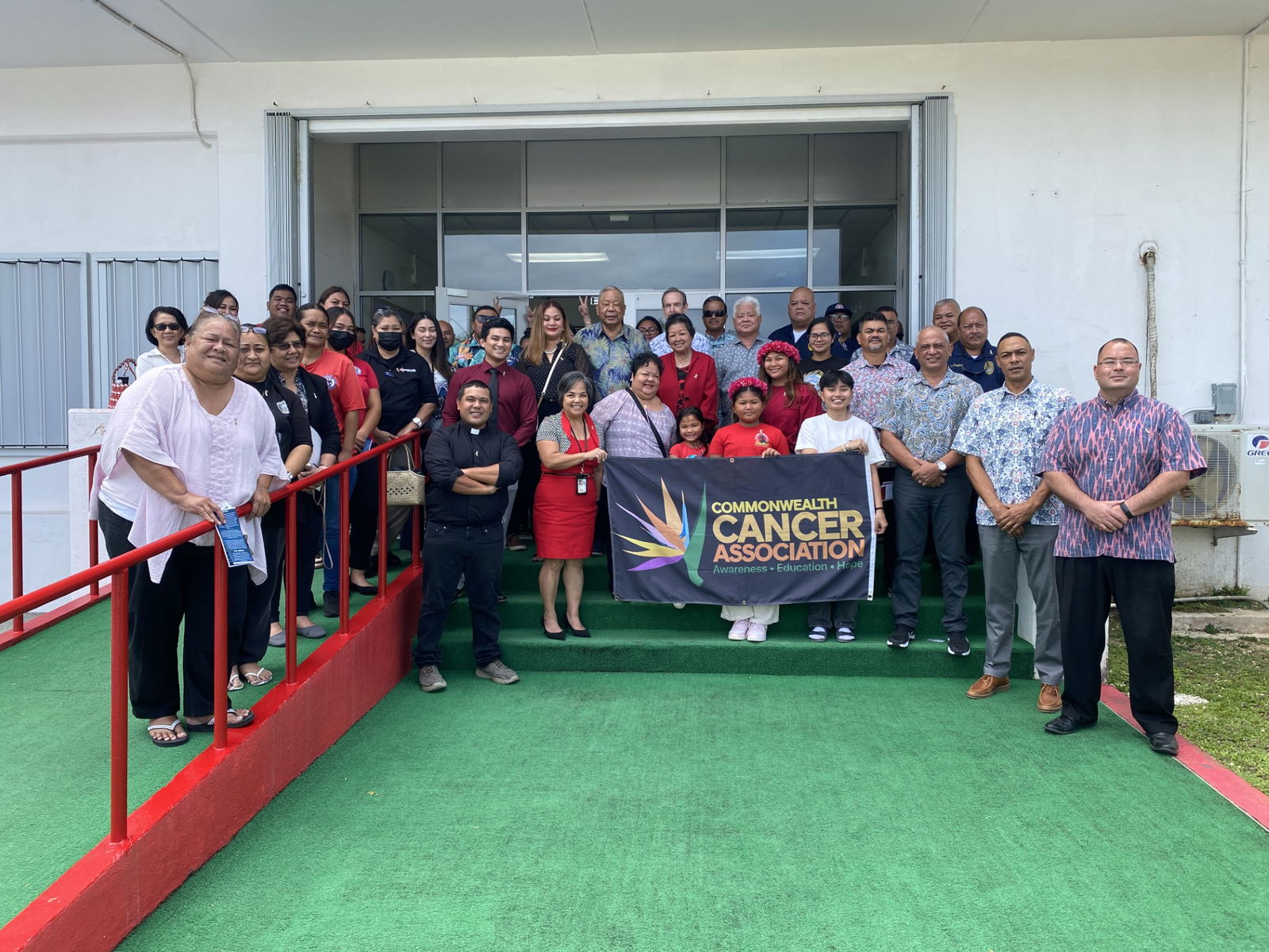 Attendees of the proclamation signing take a group photo outside the governor’s officePhoto by Andrew Roberto