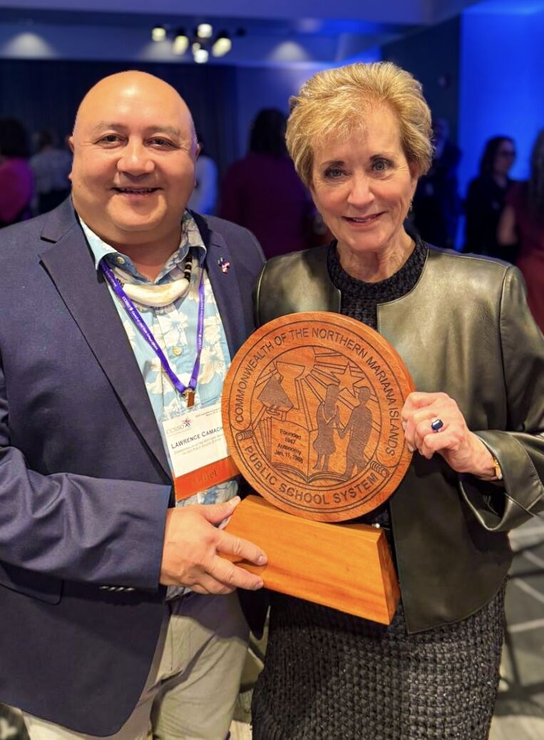 Commissioner of Education Dr. Lawrence F. Camacho met with U.S. Secretary of Education Linda McMahon, who received an official wood-carved logo of the CNMI Public School System as a token of PSS’s appreciation.