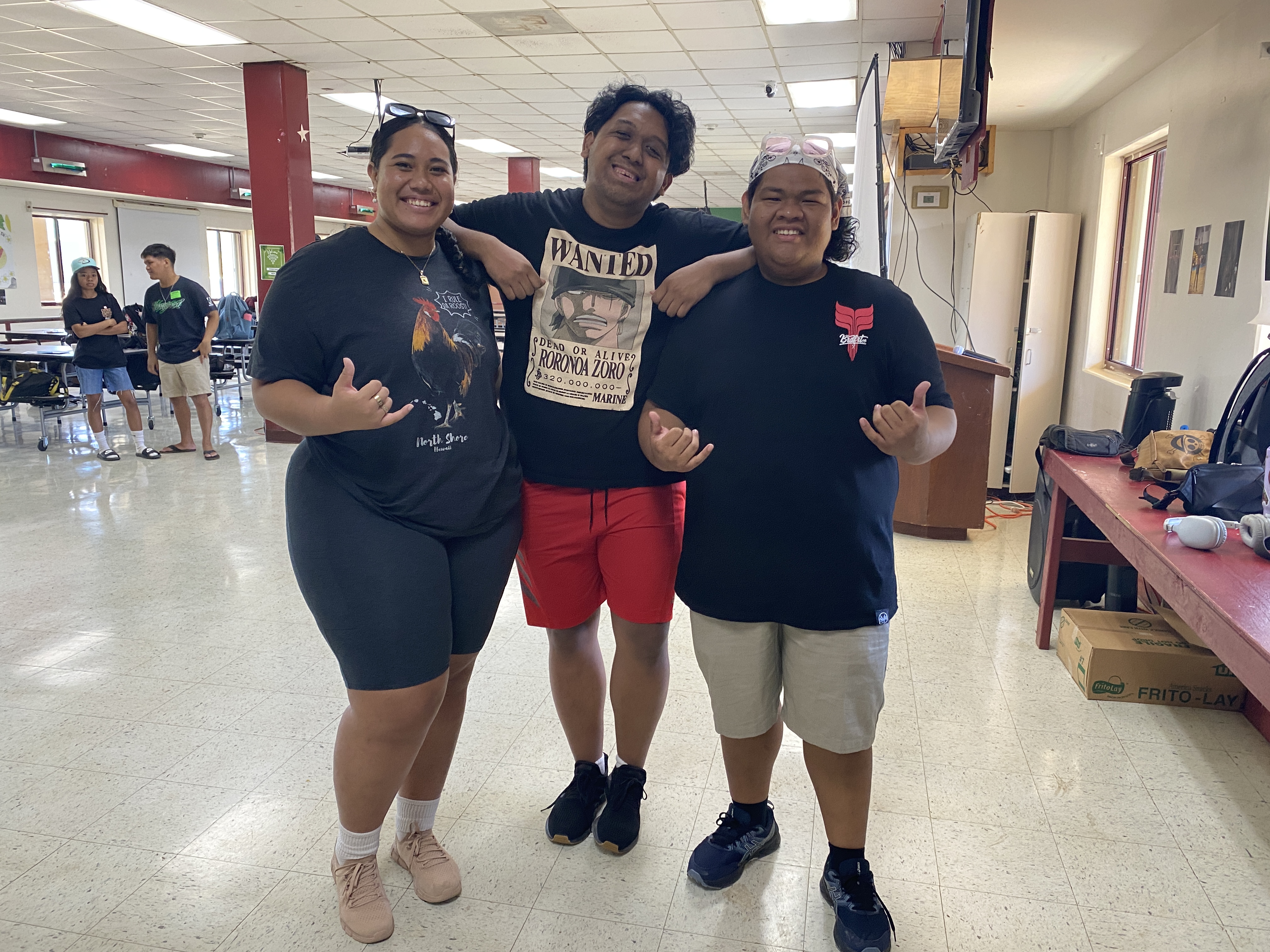 From left Kealaula Faifili, Koa Shope, and TristanKasy Henry pose for a photo during a workshop at Kagman High School.