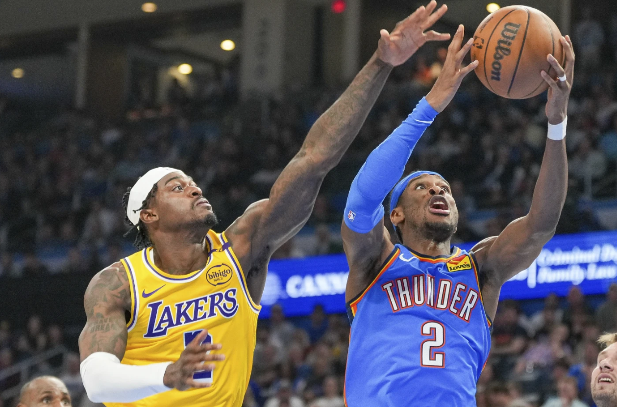 Oklahoma City Thunder guard Shai Gilgeous-Alexander, right, shoots near Los Angeles Lakers forward Jared Vanderbilt, left, during the second half of an NBA game, April 8, 2025.AP