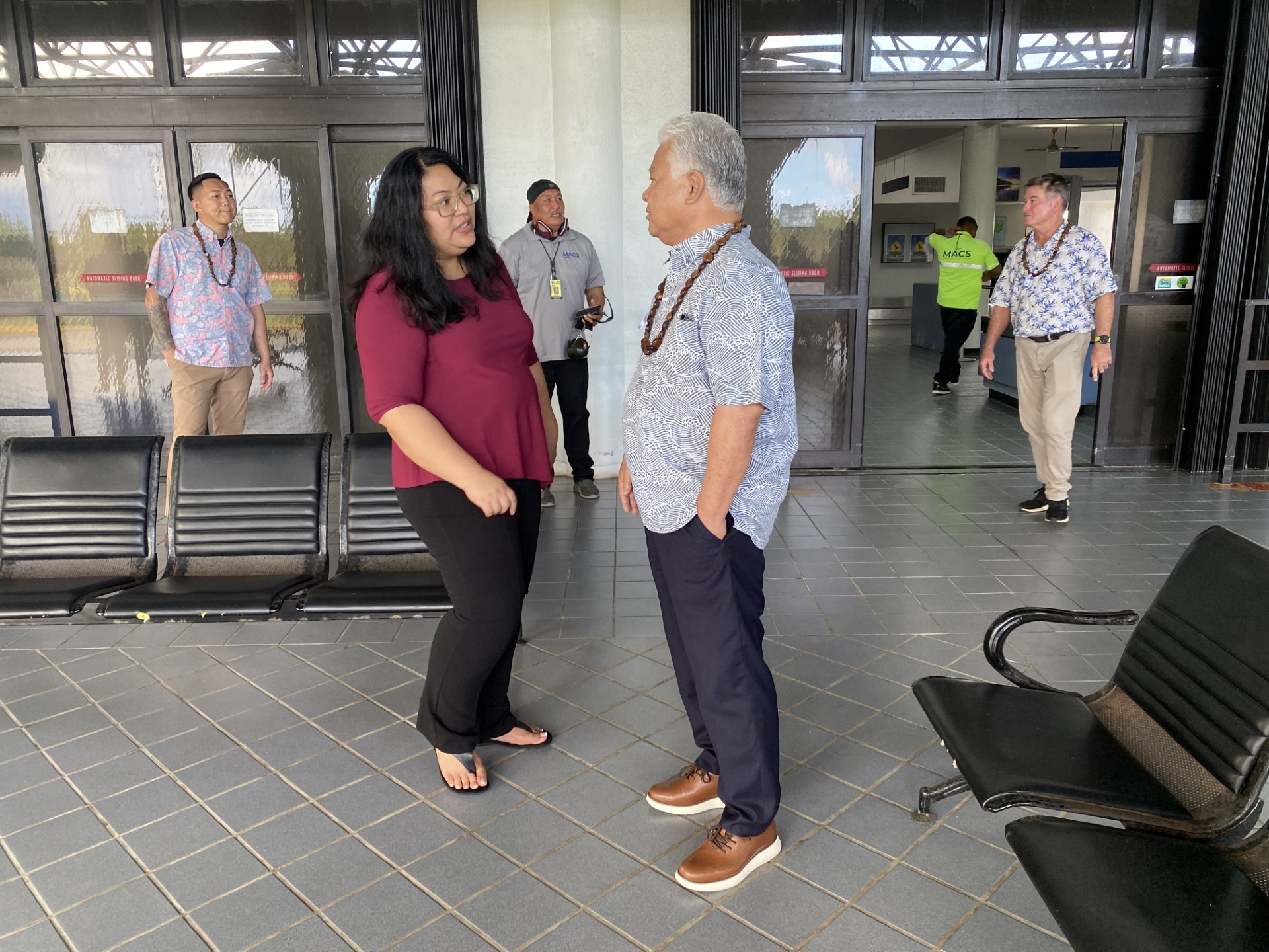 Rota Mayor Aubry Hocog talks with Gov. Arnold I. Palacios, one of the passengers of the inaugural MACS Saipan-Rota flight on Monday, April 21.