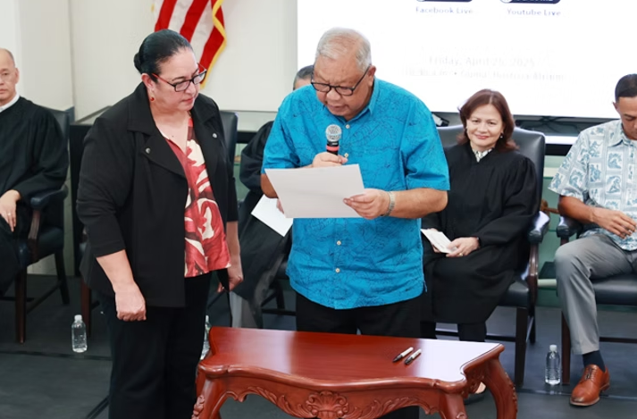 Lt. Gov. David M. Apatang reads the final resolution of the Treatment Court Month Proclamation before adding his signature.