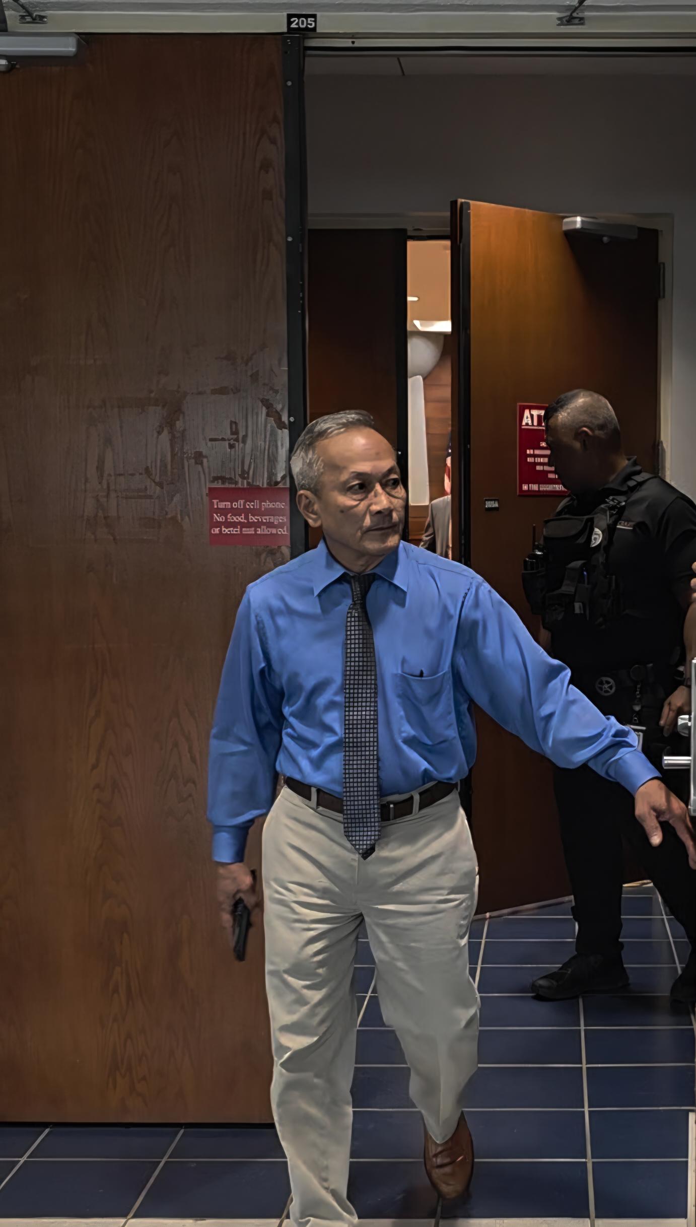 Former Rep. Vicente Camacho exits the courtroom on Wednesday.
